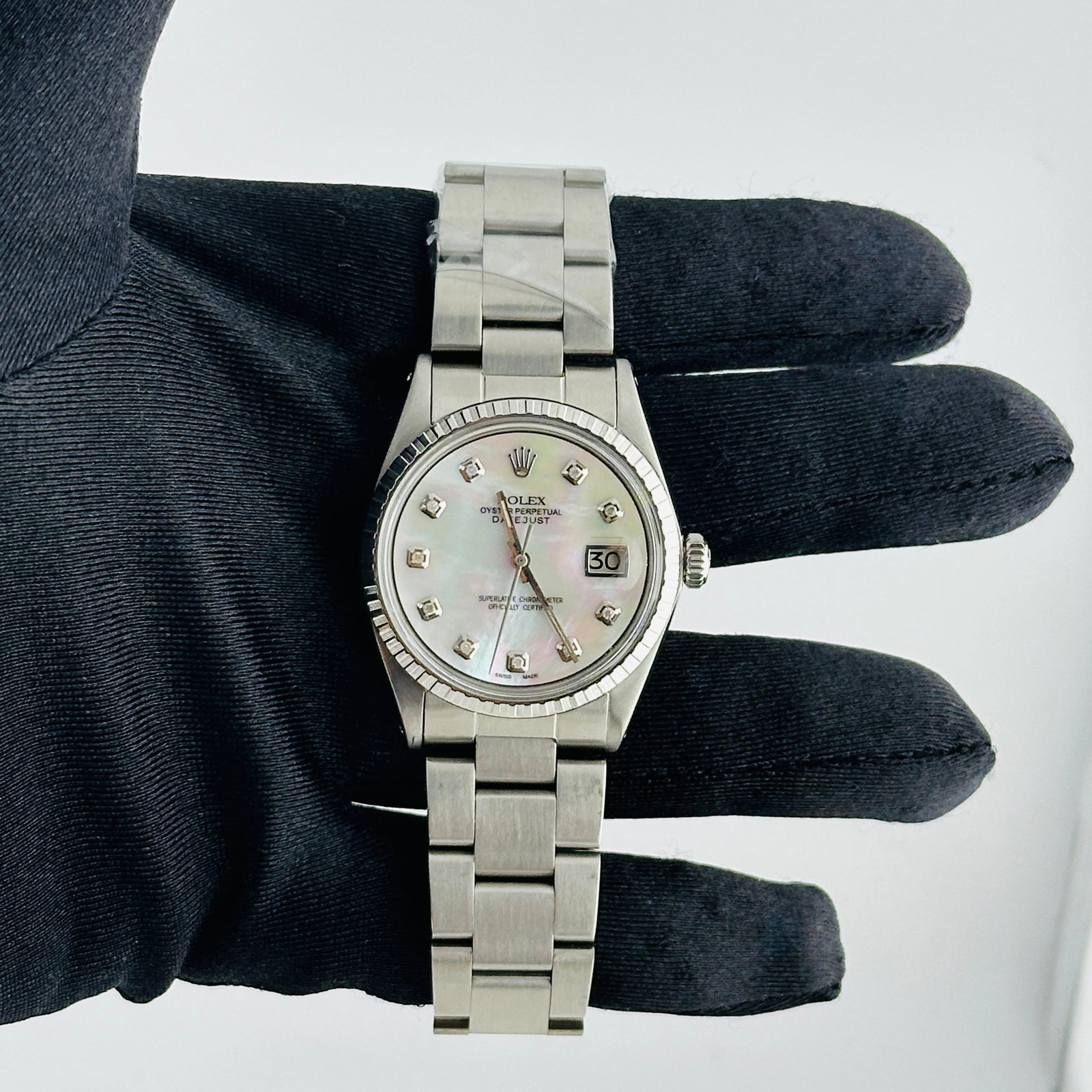 Rolex Mens Aftermarket White MOP Diamond Dial Oyster Watch Ref 1603: Rolex Mens Aftermarket White MOP Diamond Dial Oyster Watch Ref 1603 This is a men's Rolex Datejust watch, reference number 1603. It features an aftermarket white mother-of-pearl diamond dial, an engin