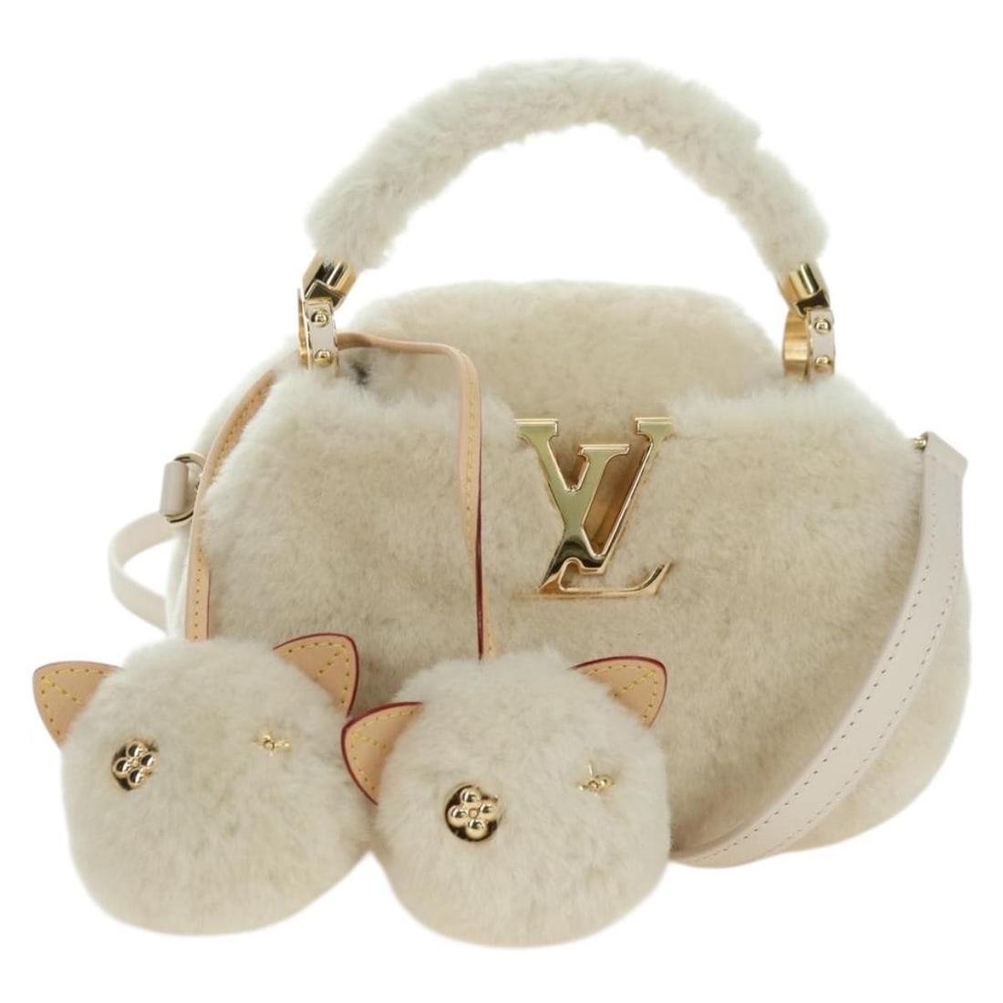 Louis Vuitton Capucines Mini Wool Beige Handbag M26324: Louis Vuitton Capucines Mini Wool Beige Handbag M26324 This Louis Vuitton LV Ski Cozygram Capucines Mini Bag is crafted from beige wool with a signature monogram pattern. Designed as a handbag, it fea