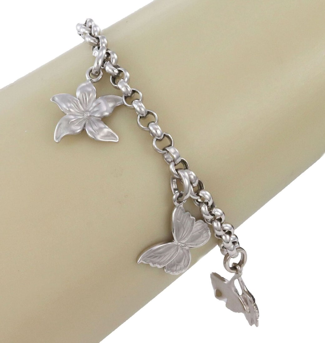 Carrera y Carrera 18k White Gold Charm Bracelet with Five Dangle Charms: Carrera y Carrera 18k White Gold Charm Bracelet with Five Dangle Charms This Carrera y Carrera bracelet is crafted from solid 18k white gold and features five sculptural dangle charms, each designed t