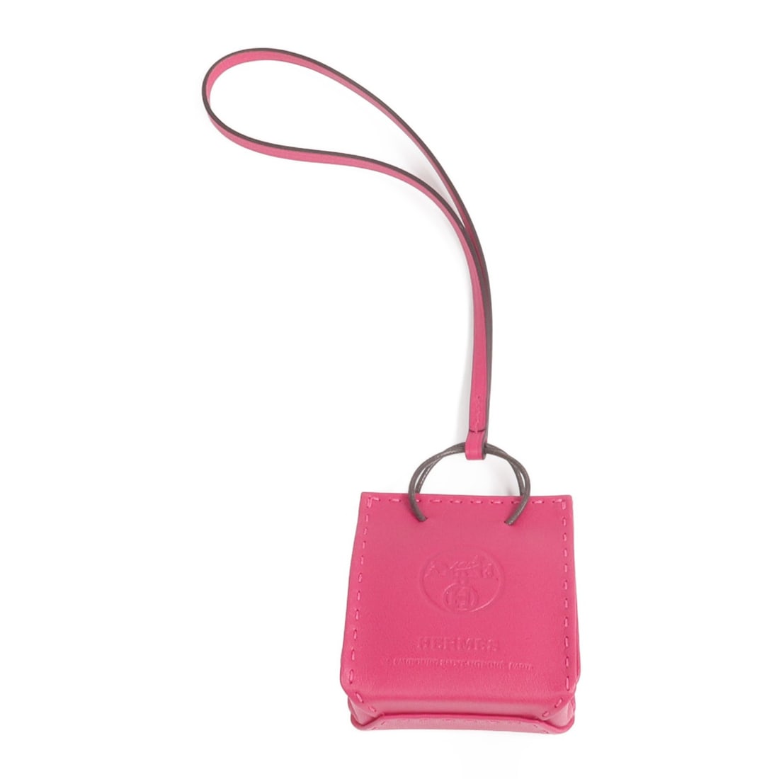 Rose Mexico Pink Leather Bag Charm by Hermes: Rose Mexico Pink Leather Bag Charm by Hermes This Hermes bag charm is crafted from Milo and Swift calfskin leather in a vibrant pink shade, inspired by Rose Mexico. Made in France, it is designed for 