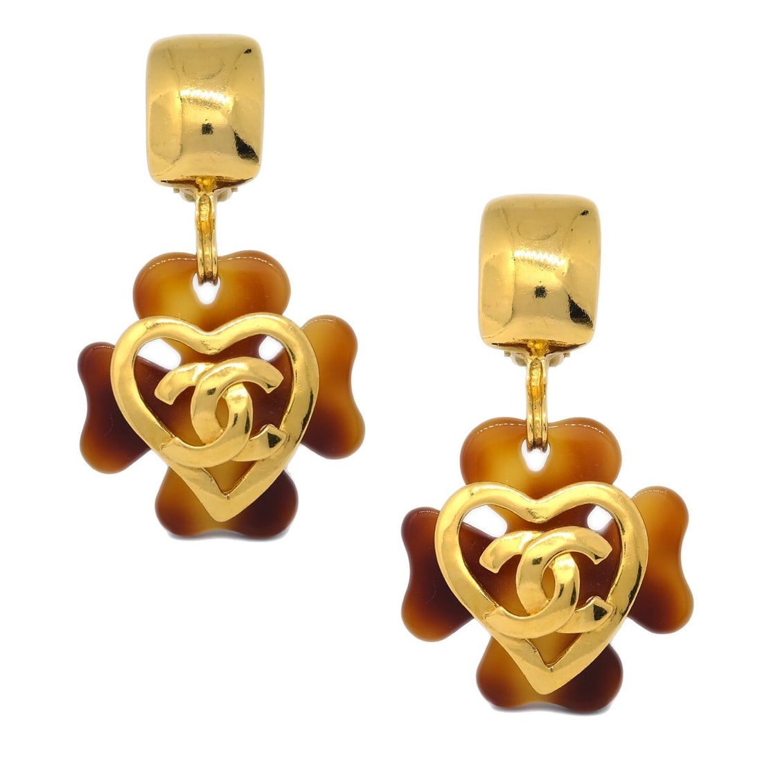 Chanel gold brown clip-on dangle clover earrings 95P: Chanel gold brown clip-on dangle clover earrings 95P These Chanel Clover dangle earrings feature a gold and brown color scheme and a stylish drop design. Made in France, they are crafted with a clip-o