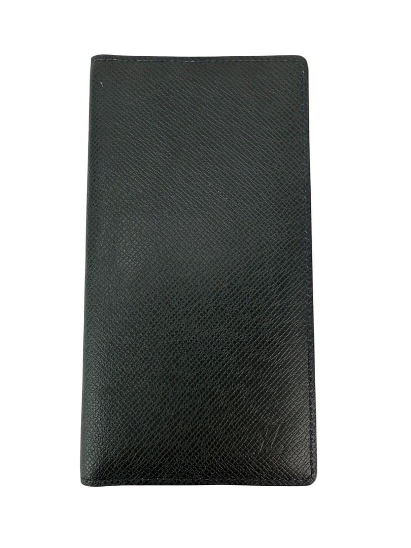 Louis Vuitton Taiga Brazza Dark Blue Leather Bifold Wallet: Louis Vuitton Taiga Brazza Dark Blue Leather Bifold Wallet The LOUIS VUITTON Taiga Brazza Long Bifold Wallet is a stylish and functional accessory crafted from high-quality blue leather. This bifold w