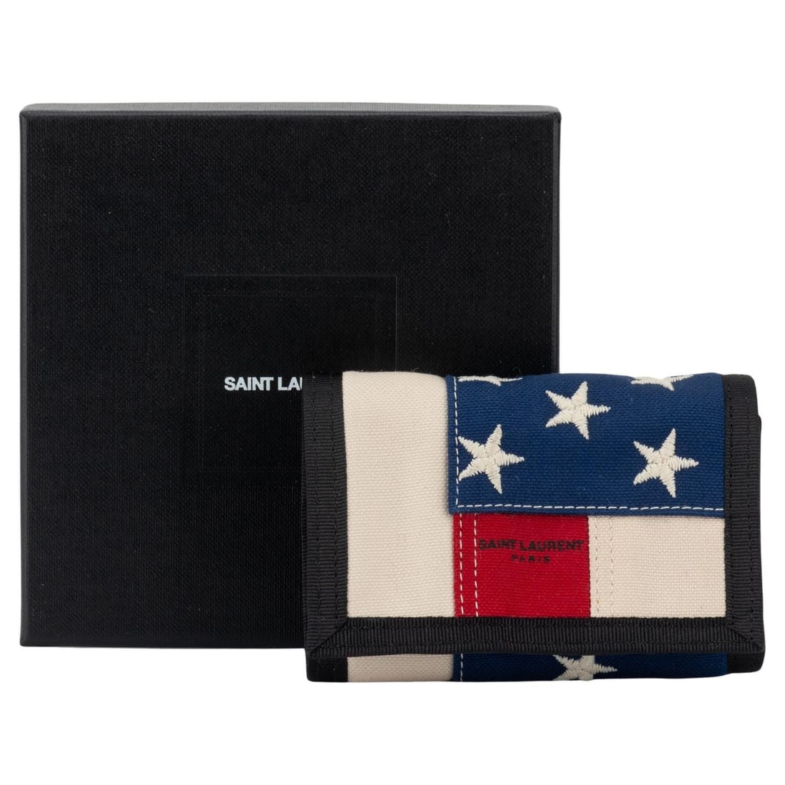 Yves Saint Laurent Small Velcro Wallet USA Flag Design: Yves Saint Laurent Small Velcro Wallet USA Flag Design Embrace a blend of style and patriotism with the Yves Saint Laurent small velcro wallet featuring the iconic American flag design. This compact w