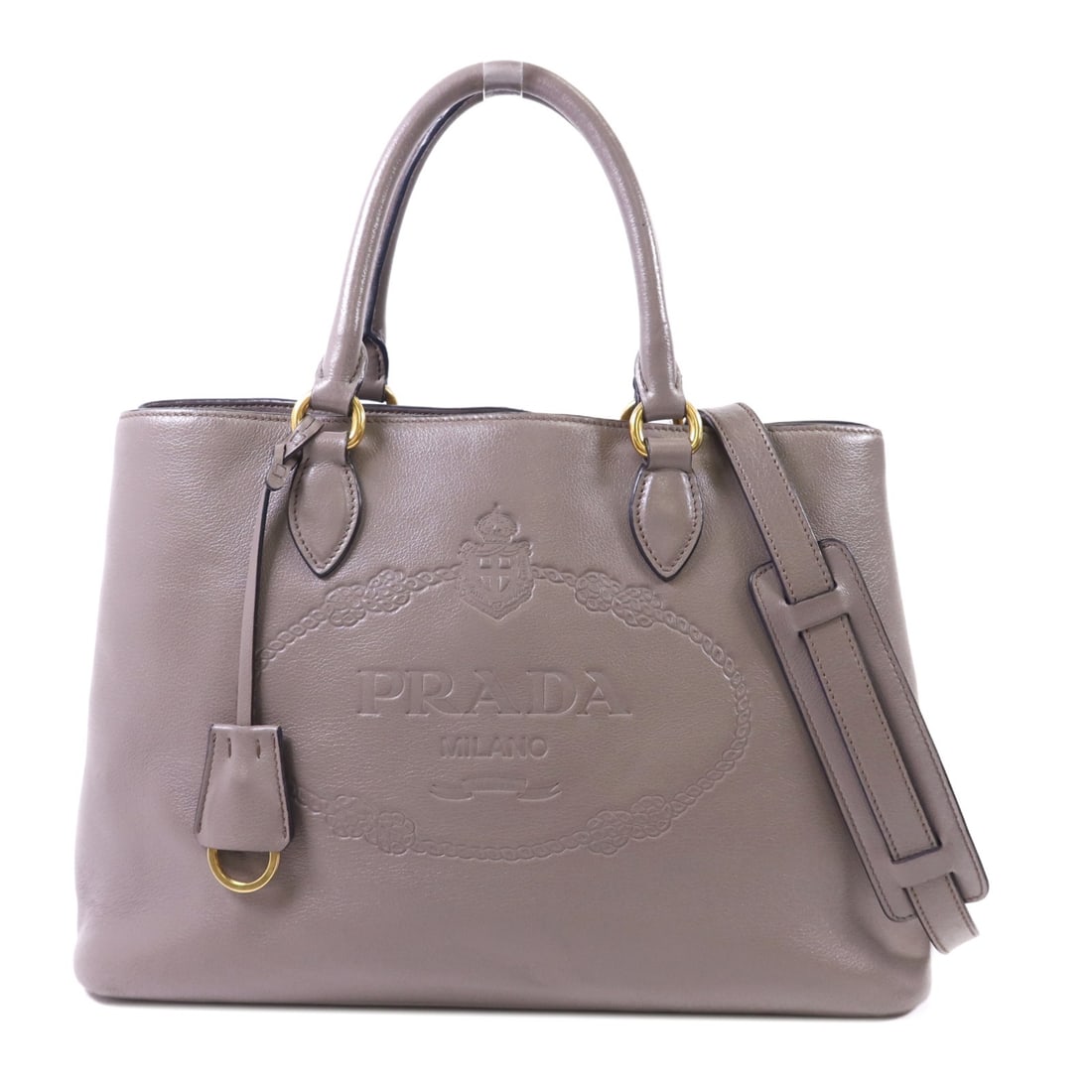 PRADA 2 Way Shoulder Bag 1BA579 Gray Calfskin Leather GHW: PRADA 2 Way Shoulder Bag 1BA579 Gray Calfskin Leather GHW This elegant PRADA 2 Way Shoulder Bag is crafted from high-quality calfskin leather in a sophisticated gray hue. With a versatile design, this