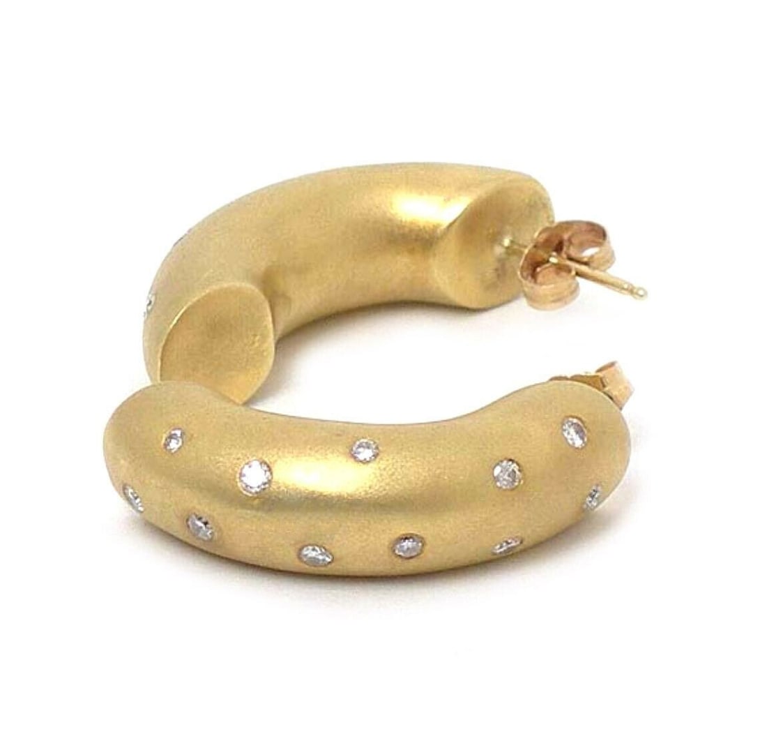 Vintage 18k Yellow Gold Curved Huggie Diamond Earrings: Vintage 18k Yellow Gold Curved Huggie Diamond Earrings These vintage huggie earrings are crafted from solid 18k yellow gold and feature a sleek curved bar design. Each earring is accented with sparkli