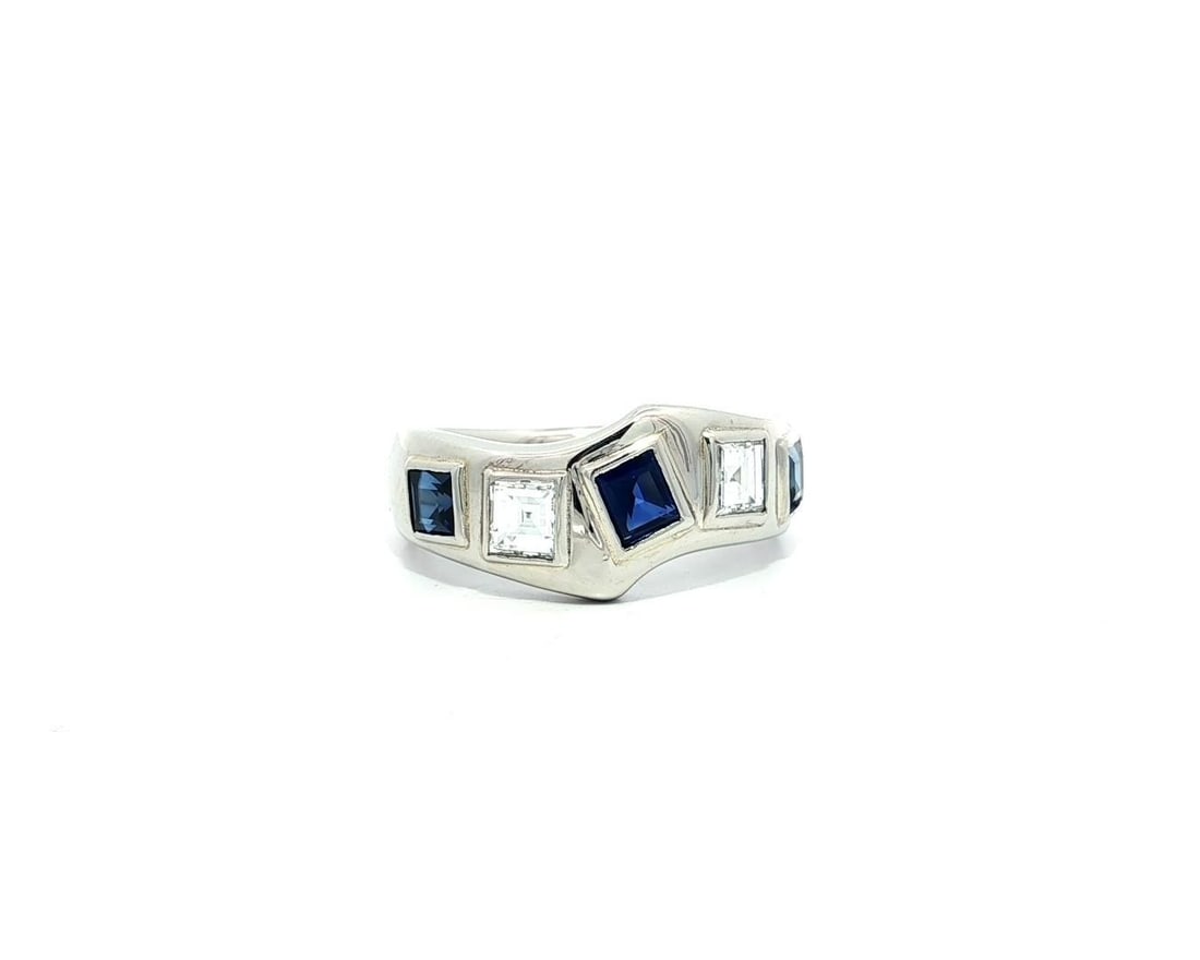 Platinum 1.66ctw Wavy Band Ring with Blue Sapphire and Diamonds: Platinum 1.66ctw Wavy Band Ring with Blue Sapphire and Diamonds This exquisite Platinum Band Ring features a stunning design with a wavy silhouette, adorned with natural blue sapphires and diamonds. T