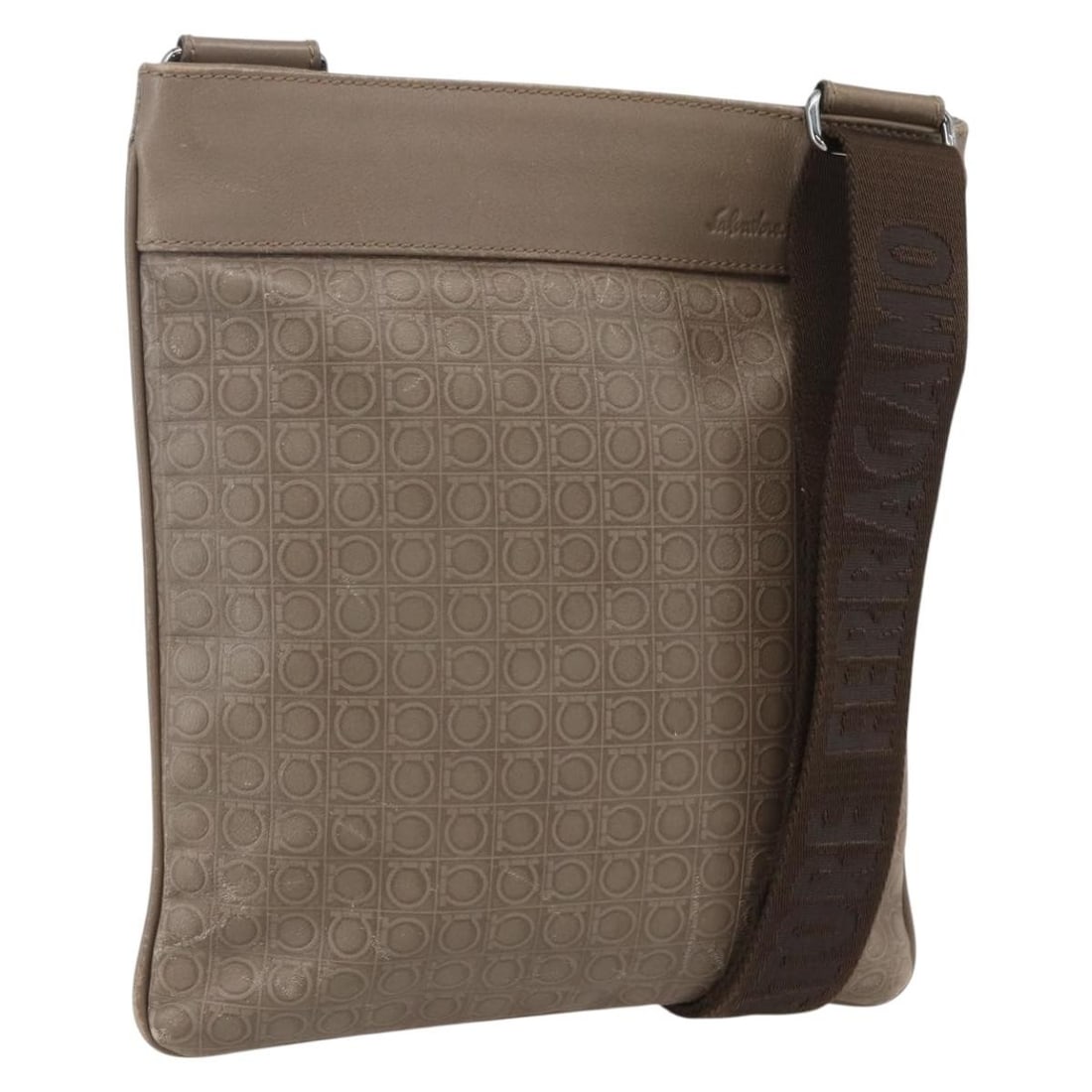 Gancini beige leather shoulder bag by Salvatore Ferragamo: Gancini beige leather shoulder bag by Salvatore Ferragamo This Salvatore Ferragamo Gancini Shoulder Bag is crafted from beige leather and designed for women. It features a slim profile, signature Ganc