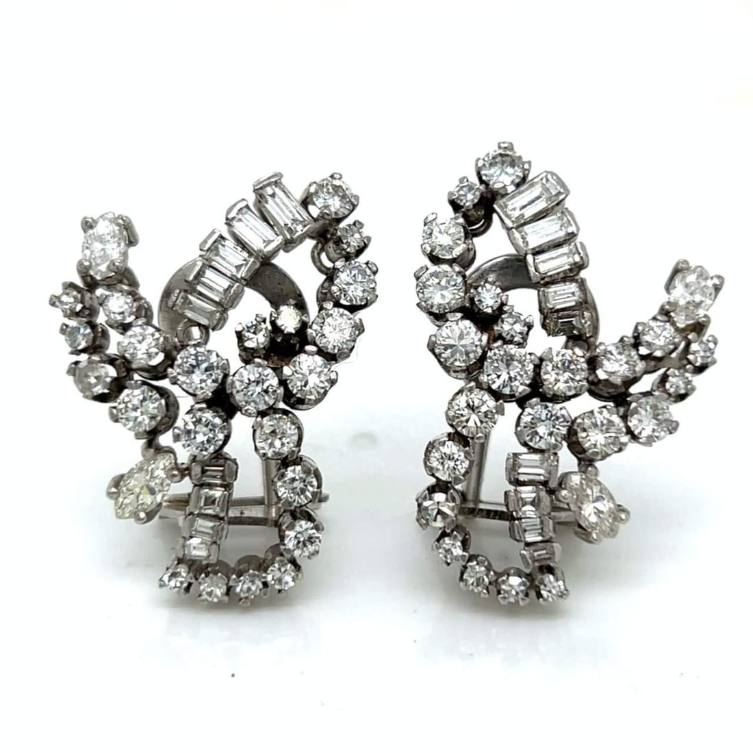 Vintage 1950's 18K White Gold Diamond Earrings 5.00 Ct.: Vintage 1950's 18K White Gold Diamond Earrings 5.00 Ct. Elevate your elegance with these stunning 1950's earrings crafted from 18K white gold. Each earring is adorned with 66 diamonds, totaling approx