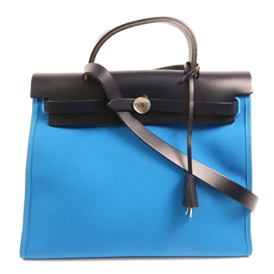 Herbag PM Blue Canvas Shoulder Bag with Palladium Hardware by Hermes: Herbag PM Blue Canvas Shoulder Bag with Palladium Hardware by Hermes This Hermes Herbag PM is a versatile 2-way shoulder bag designed for women. Crafted from blue canvas, it features both shoulder and