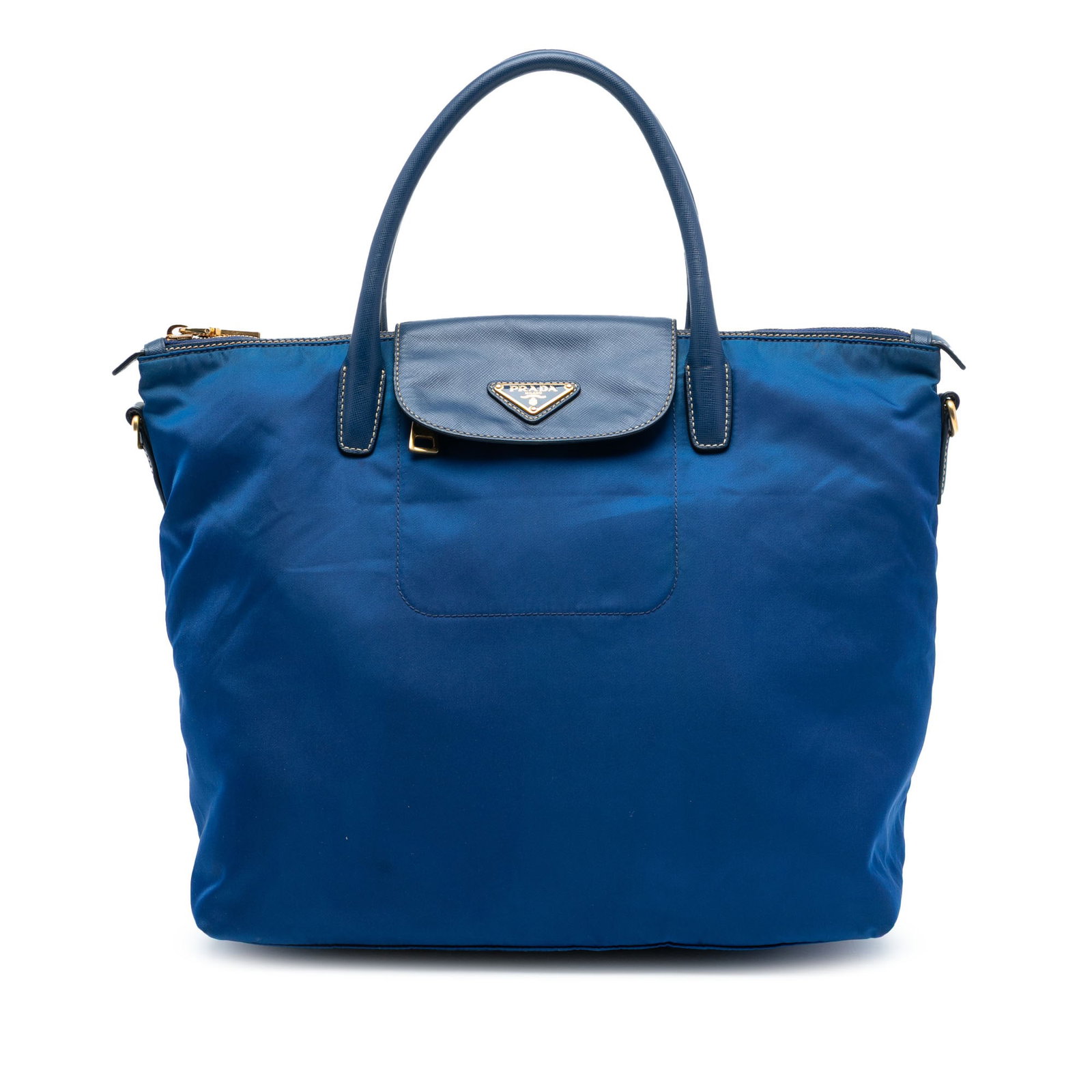 Prada Tessuto Blue Satchel with Saffiano Leather Accents: Prada Tessuto Blue Satchel with Saffiano Leather Accents This Prada Saffiano Trimmed Tessuto Satchel features a durable nylon body with saffiano leather trim, rolled leather handles, a flap with a top