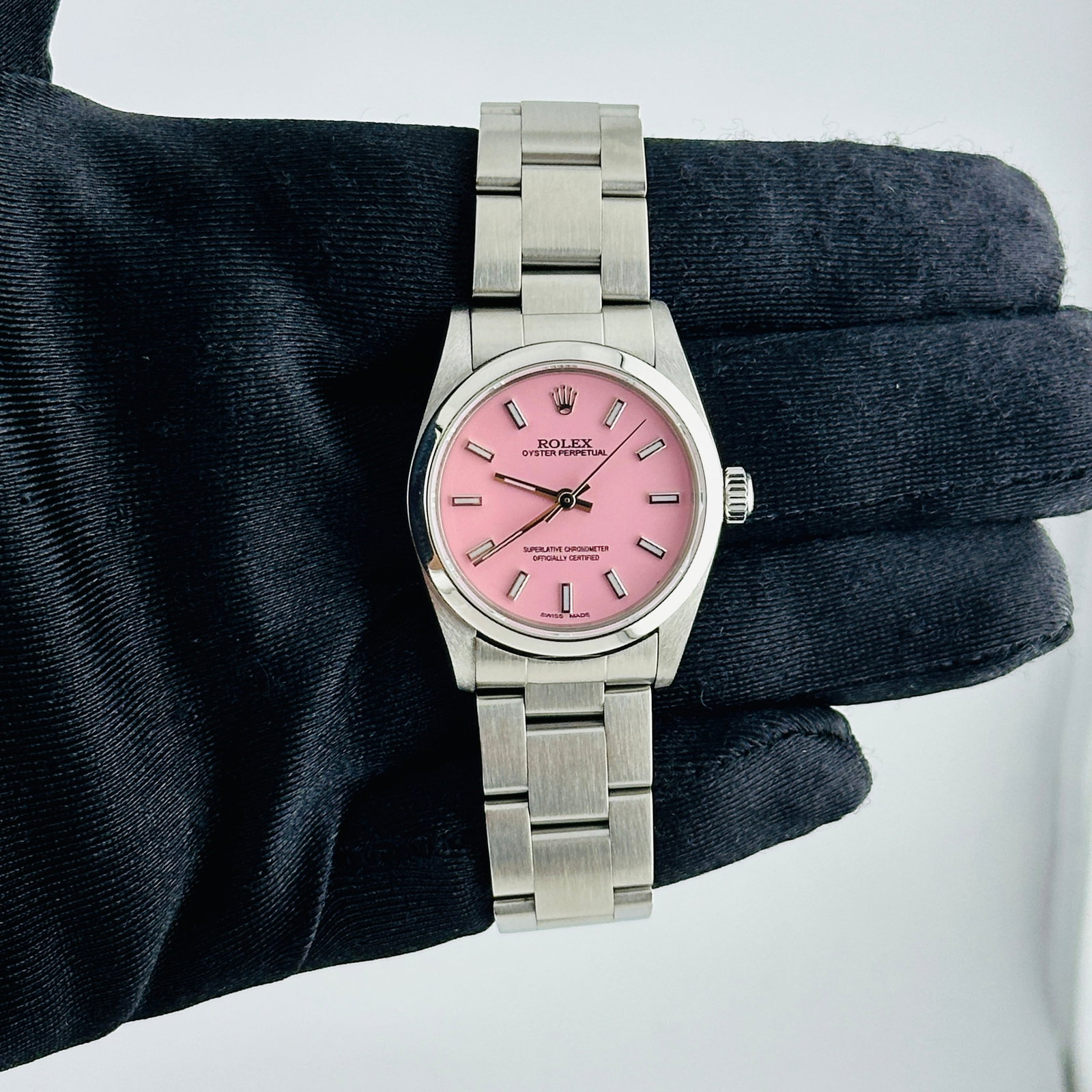 Ladies Rolex Oyster Perpetual Ref 77080 Aftermarket Pink Stick Dial on Oyster Bracelet: Ladies Rolex Oyster Perpetual Ref 77080 Aftermarket Pink Stick Dial on Oyster Bracelet This ladies' Rolex Oyster Perpetual features an aftermarket pink stick dial and is paired with the classic Oyster
