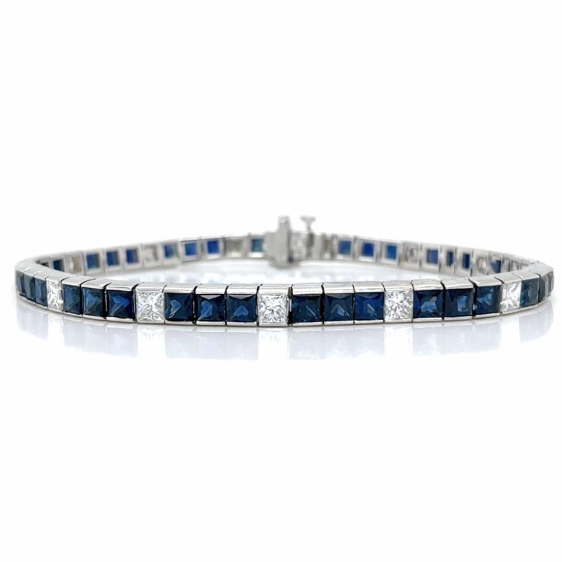 Sapphire and Diamond Tennis Bracelet in 18K White Gold 7.25 Inch: Sapphire and Diamond Tennis Bracelet in 18K White Gold 7.25 Inch This elegant tennis bracelet is crafted from 18K white gold and features 39 sapphires with an approximate total weight of 8.00 carats, 