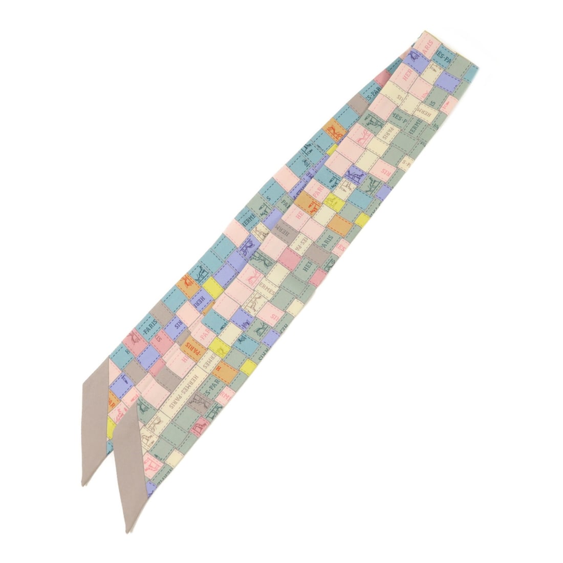 Hermes silk multicolor Twilly scarf: Hermes silk multicolor Twilly scarf This Hermes Twilly scarf is crafted from luxurious silk and features a vibrant multicolor design. Made in France, it is designed for women and offers a versatile ac
