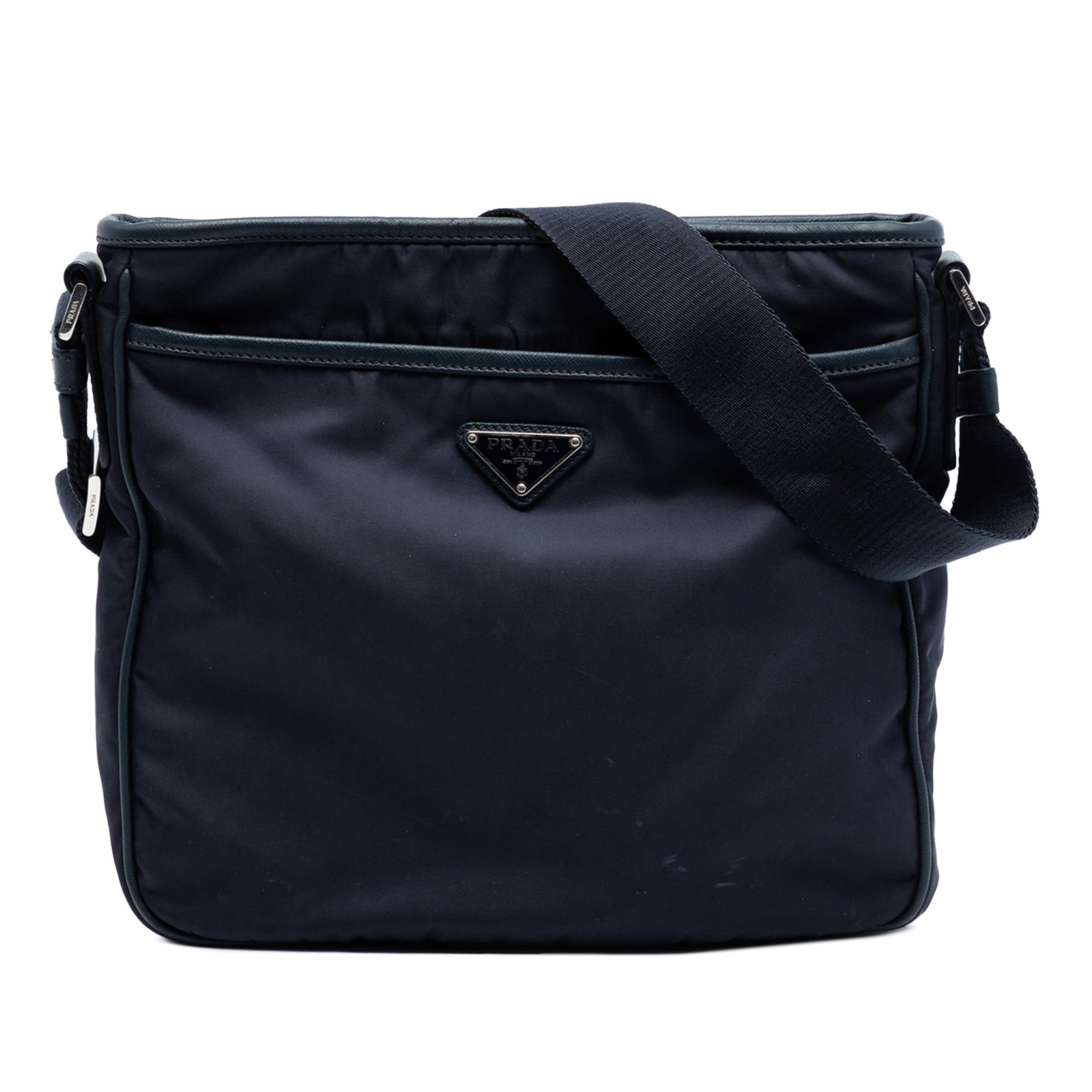 Prada Tessuto Blue Nylon Crossbody with Saffiano Leather Accents: Prada Tessuto Blue Nylon Crossbody with Saffiano Leather Accents This Prada crossbody bag features a blue nylon body accented with saffiano leather trim. It is designed with a flat adjustable strap fo