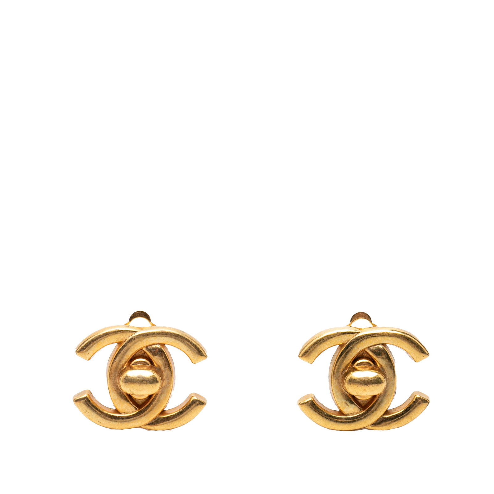 Chanel CC Gold Plated Clip On Earrings Turn Lock: Chanel CC Gold Plated Clip On Earrings Turn Lock These Chanel earrings feature a gold plated metal construction with the iconic CC turn lock design and clip-on back closures. Made in France, they are 