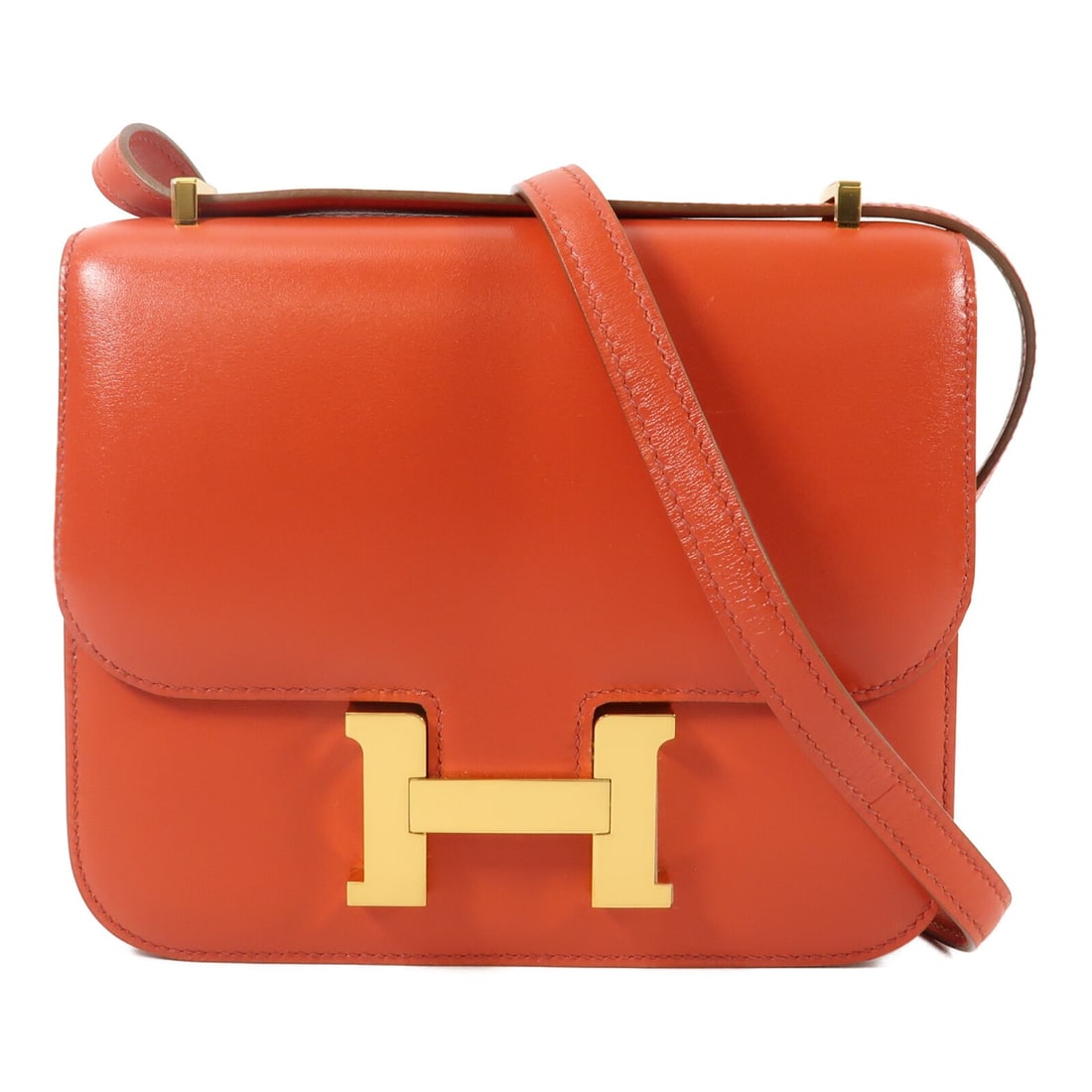 Hermes Constance Mini Red Tadelakt Leather Shoulder Bag with Gold Hardware: Hermes Constance Mini Red Tadelakt Leather Shoulder Bag with Gold Hardware This Hermes Constance Mini shoulder bag is crafted from luxurious Tadelakt calfskin leather in a striking red color. Designed