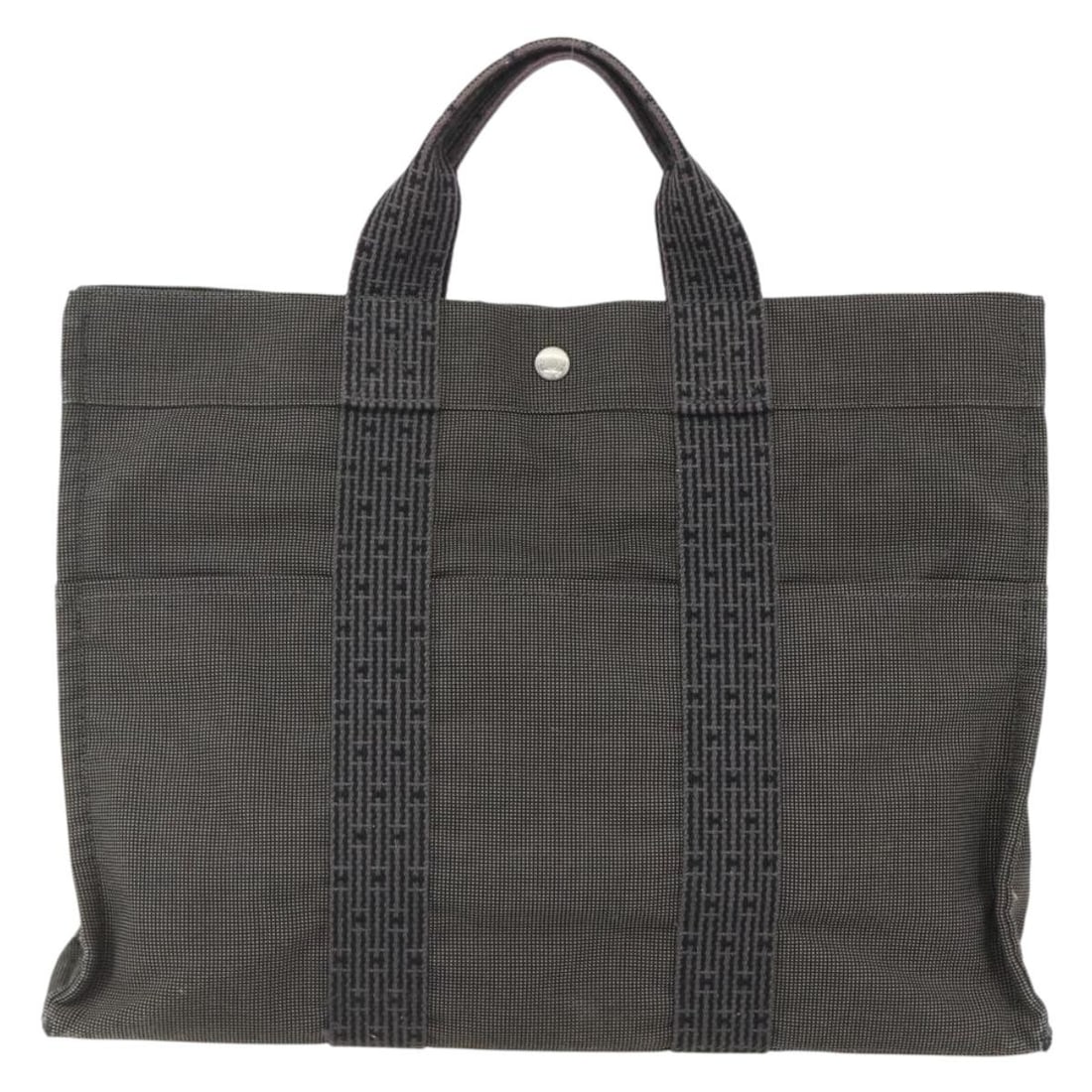 Hermes Fourre-tout Herline gray canvas handbag 44cm x 32cm x 10cm: Hermes Fourre-tout Herline gray canvas handbag 44cm x 32cm x 10cm The Hermes Fourre-tout Herline is a pre-owned women's handbag crafted from gray canvas. It features spacious interior compartments and