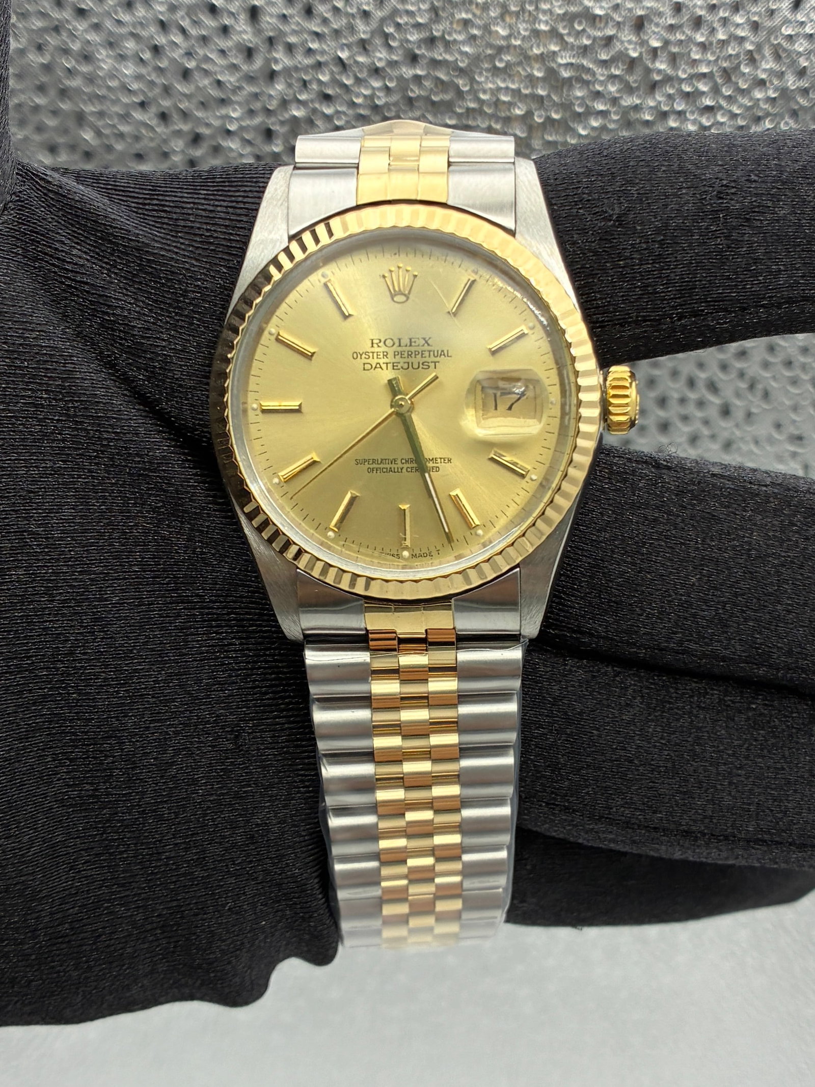 Rolex Datejust 16013 Champagne Stick Dial Aftermarket Jubilee Bracelet: Rolex Datejust 16013 Champagne Stick Dial Aftermarket Jubilee Bracelet This Rolex Datejust features a champagne stick dial and a fluted bezel, paired with an aftermarket Jubilee bracelet. The watch is