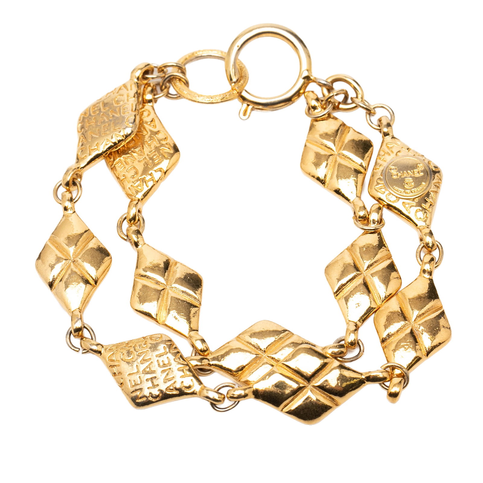 Chanel quilted diamond chain bracelet gold plated metal: Chanel quilted diamond chain bracelet gold plated metal This Chanel bracelet features a gold plated metal construction with a distinctive quilted diamond shape and a double chain design. It is secured