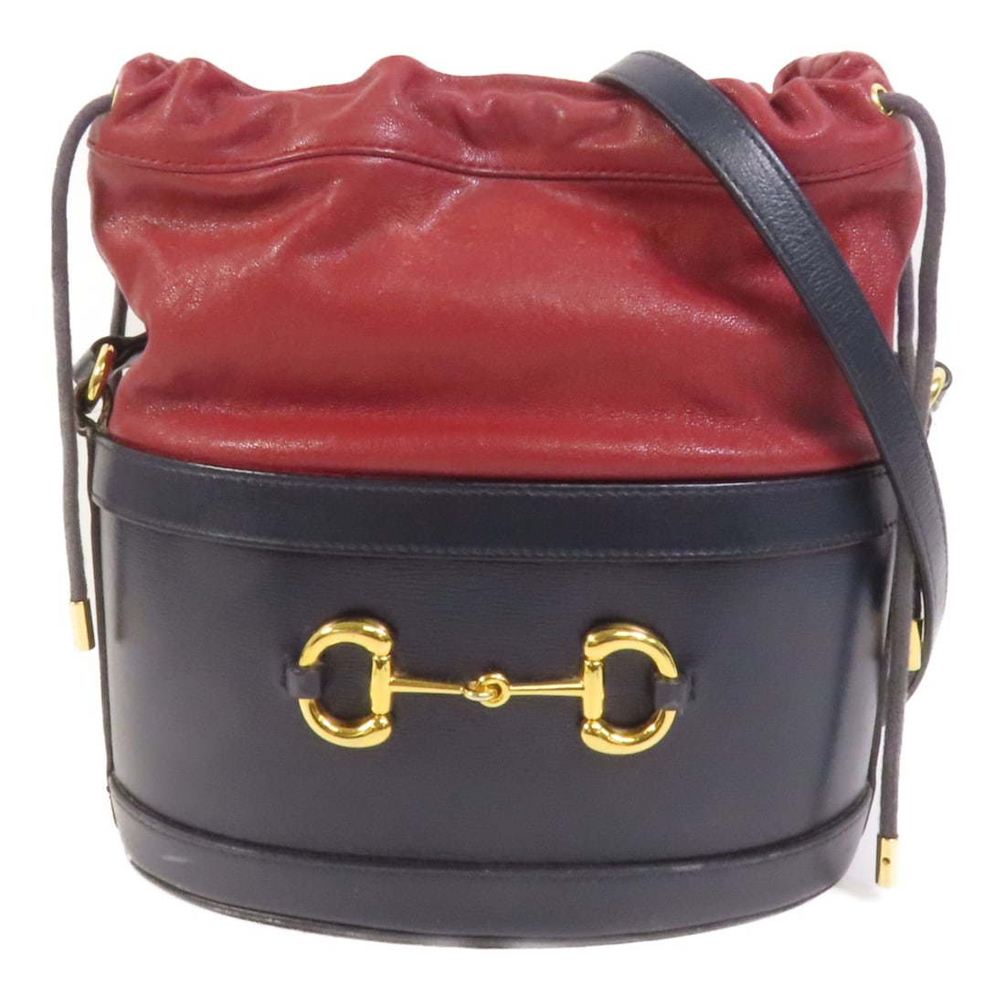 Gucci 1955 Horsebit Navy Calfskin Bucket Shoulder Bag with Gold Hardware: Gucci 1955 Horsebit Navy Calfskin Bucket Shoulder Bag with Gold Hardware This Gucci 1955 Horsebit bucket shoulder bag is crafted from navy calfskin leather and features gold hardware. Designed for wom