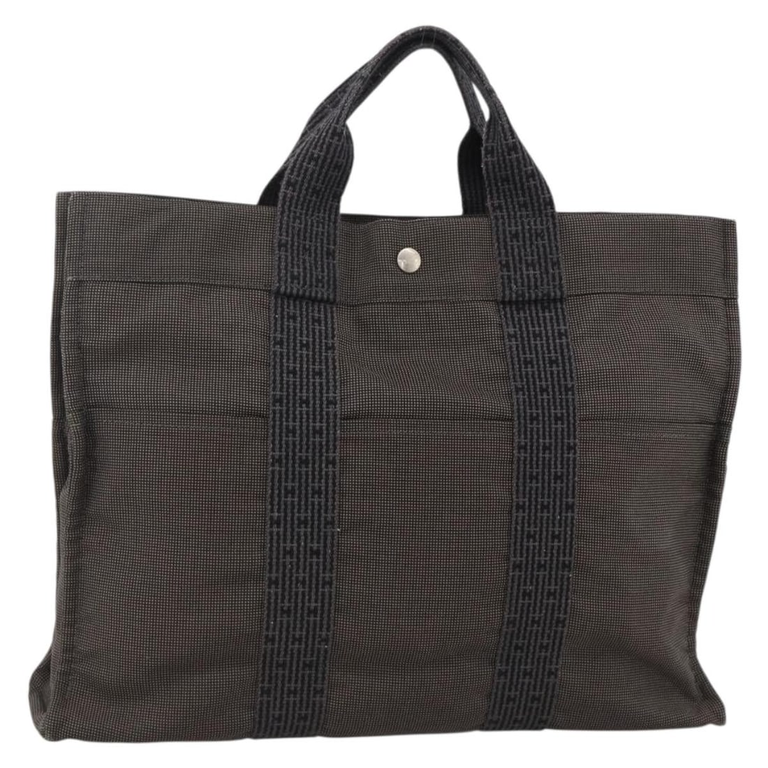 Fourre-tout Herline gray canvas tote bag by Hermes France: Fourre-tout Herline gray canvas tote bag by Hermes France This Hermes Fourre-tout Herline bag is crafted from gray canvas and designed for women. The bag features a spacious interior and practical han