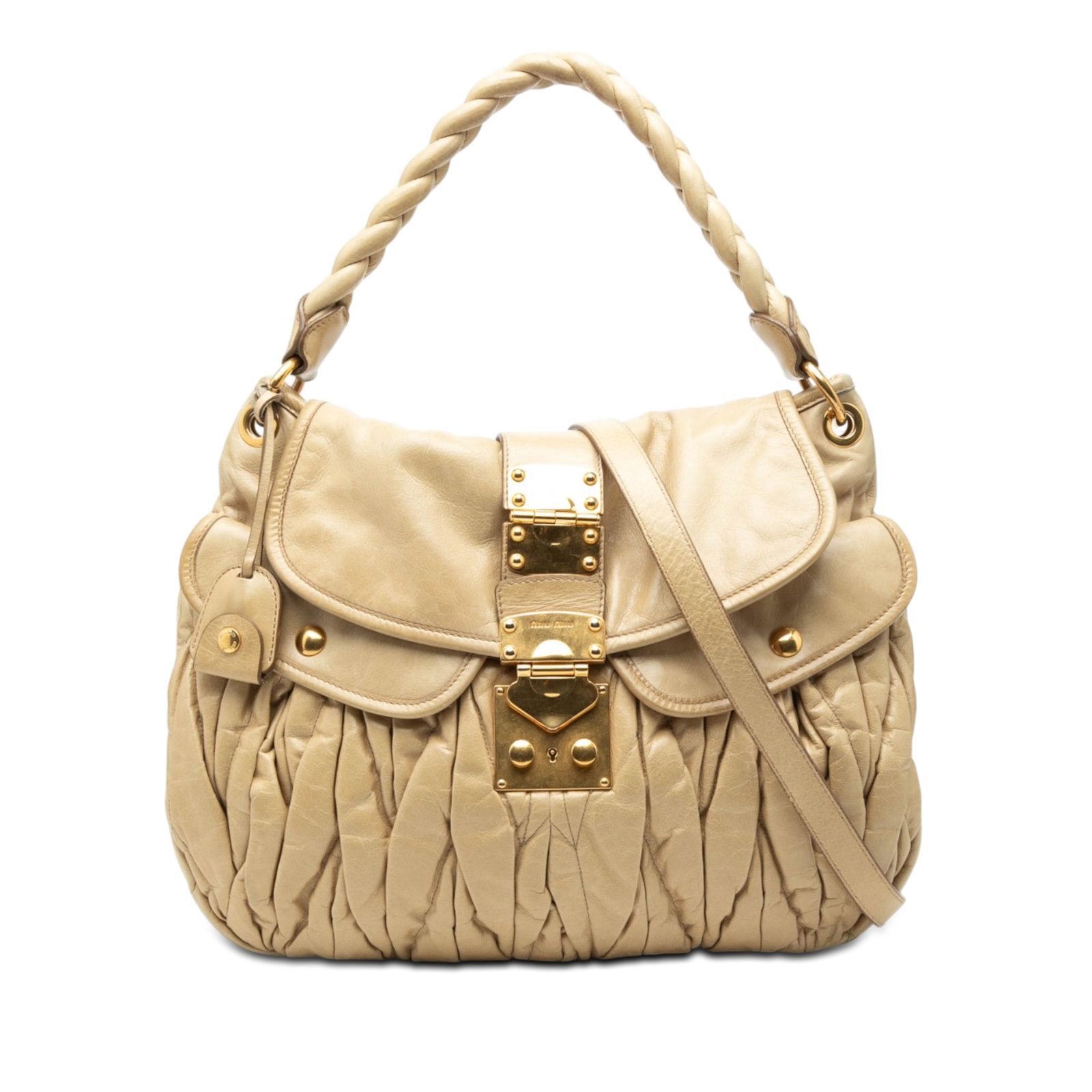Miu Miu Matelasse Nappa Beige Leather Satchel: Miu Miu Matelasse Nappa Beige Leather Satchel This Miu Miu Matelasse Nappa Coffer Satchel features a pleated beige leather body accented with gold-tone hardware. It is designed with a rolled braided h