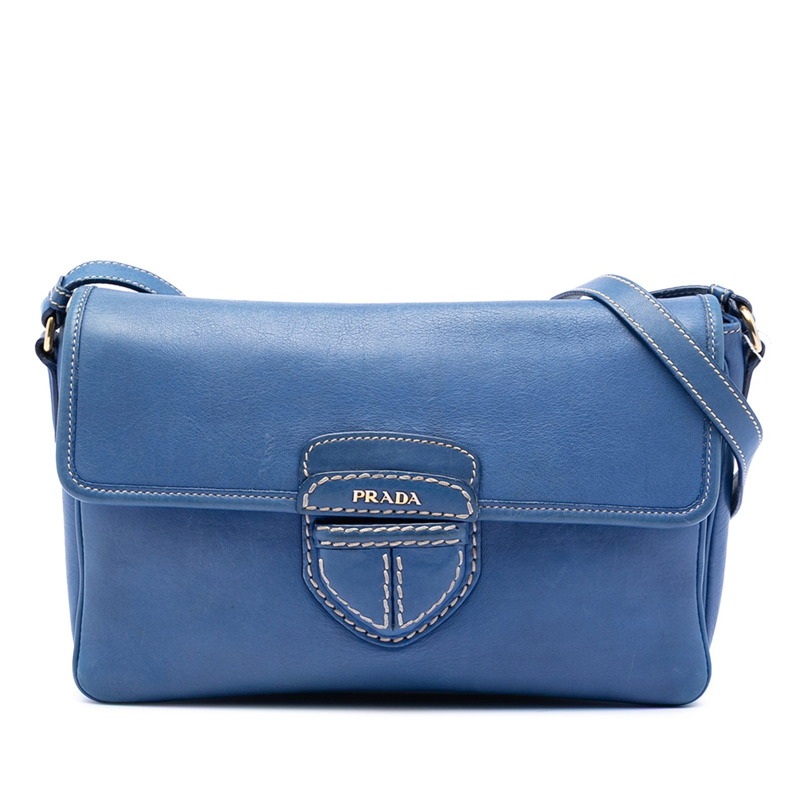 Prada City Calf Pattina Blue Leather Crossbody Bag with Adjustable Strap: Prada City Calf Pattina Blue Leather Crossbody Bag with Adjustable Strap The Prada City Calf Pattina Crossbody is crafted from blue leather and features an adjustable flat leather strap, a front flap 