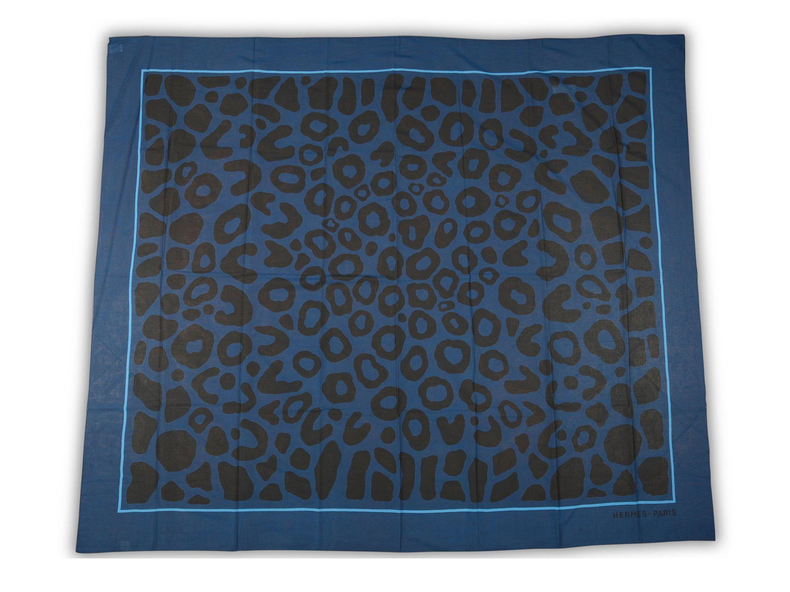Leopard Print Cotton Sarong by Hermes with Hand Rolled Edges: Leopard Print Cotton Sarong by Hermes with Hand Rolled Edges This Hermes "Leopard" sarong is crafted from 100% cotton and features hand rolled edges. It showcases a classic all-over leopard print with