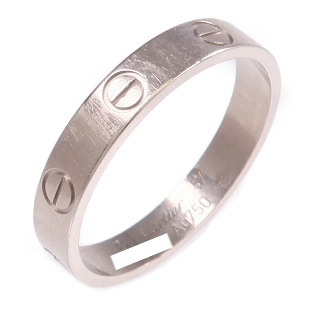 Cartier Love Mini 18K White Gold Ring US 8: Cartier Love Mini 18K White Gold Ring US 8 This Cartier Mini Love Ring is crafted from 18K white gold and features a sleek, minimalist design in a silver tone. Designed for unisex wear, it does not fe