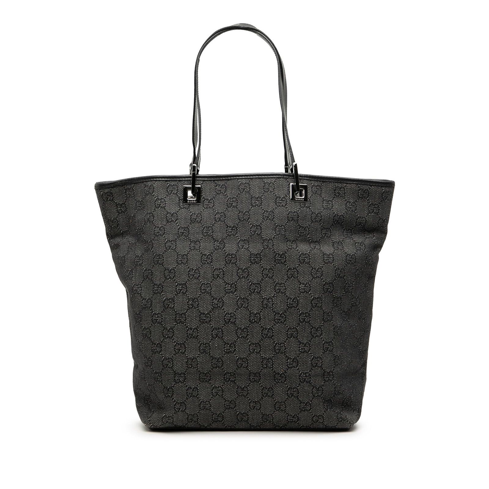 Gucci gray denim tote with leather trim: Gucci gray denim tote with leather trim This Gucci GG Denim Tote is crafted from denim with leather trim and features flat leather straps, an open top, and an interior zip pocket. The bag is gray in c