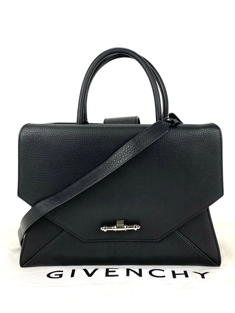 Givenchy Obsedia Medium Flap Black Calfskin Satchel with Dust Bag: Givenchy Obsedia Medium Flap Black Calfskin Satchel with Dust Bag Elevate your style with this Givenchy Obsedia Medium Flap Hand Bag crafted from luxurious black pebbled calfskin leather. This designe