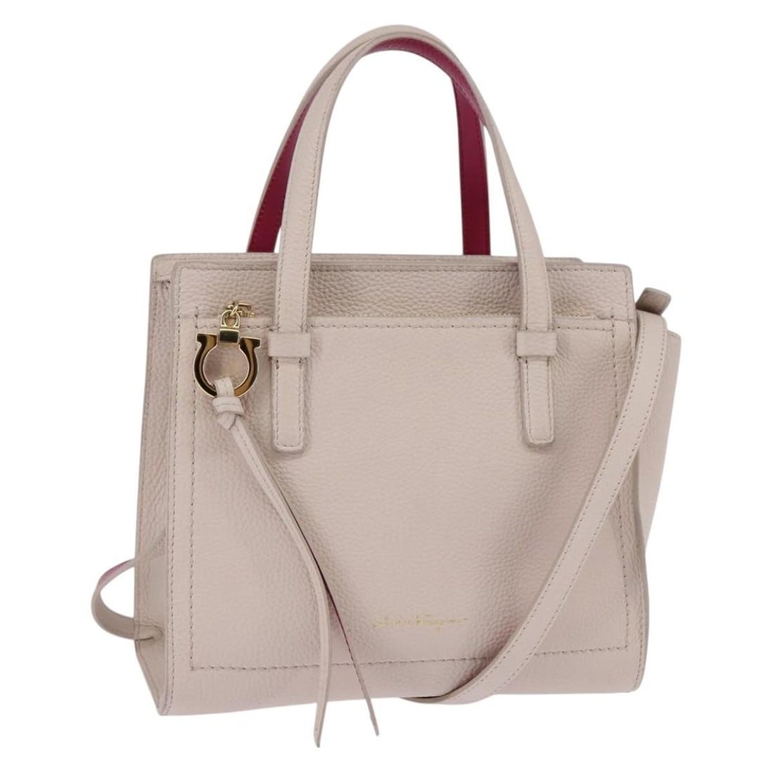 Amy Tote Bag in Beige Pebbled Leather by Salvatore Ferragamo: Amy Tote Bag in Beige Pebbled Leather by Salvatore Ferragamo This Salvatore Ferragamo Amy Tote is crafted from pebbled beige leather and features a spacious silhouette designed for women. The bag is p