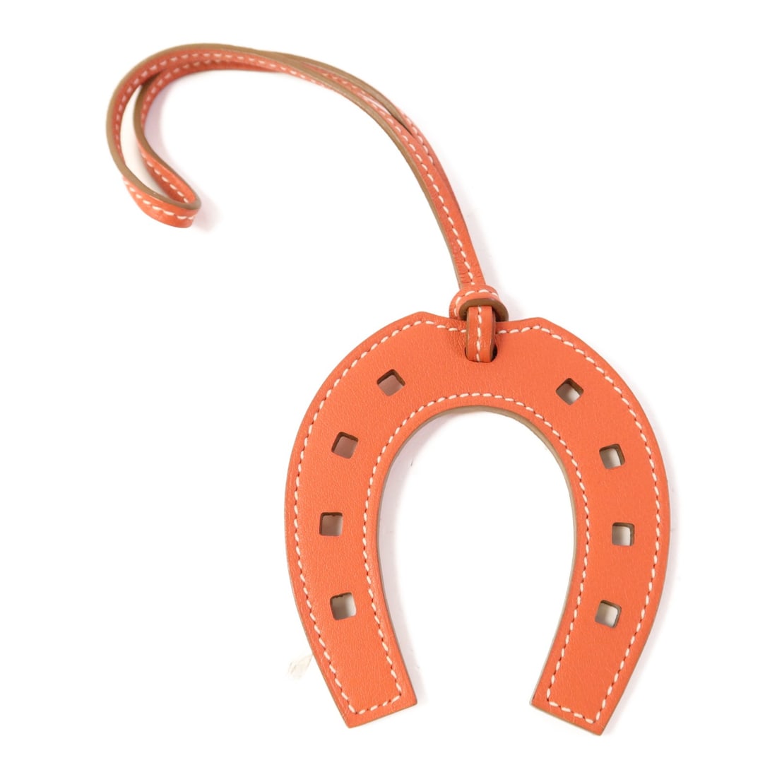 Hermes Sanguine Leather Padlock Horseshoe Charm: Hermes Sanguine Leather Padlock Horseshoe Charm This Hermes padlock horseshoe charm is crafted from Veau Swift calfskin leather in a vibrant orange color. Designed for women, it features a distinctive