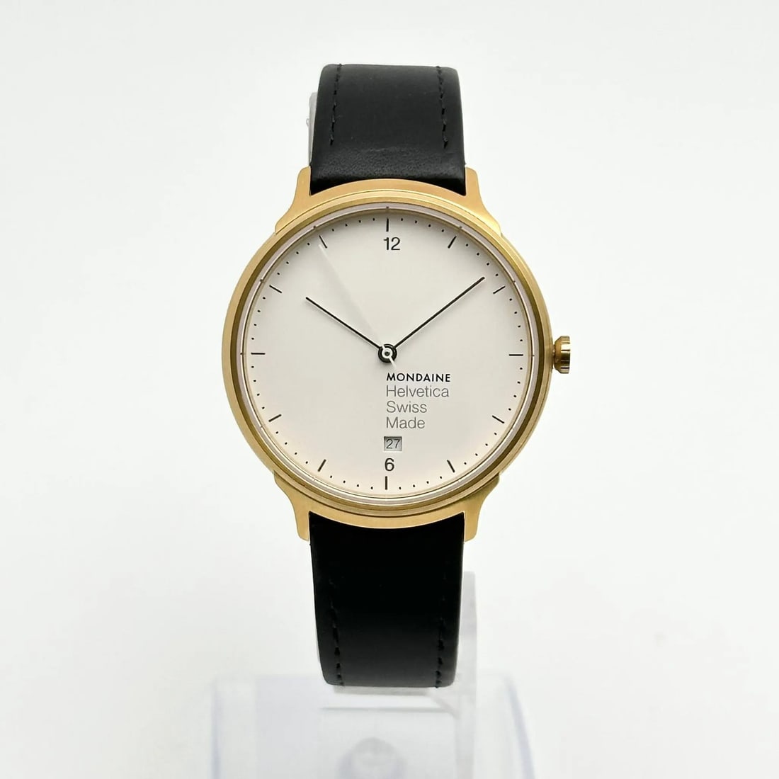 Mondaine Helvetica No1 38mm Gold-Tone Steel White Dial Quartz Watch: Mondaine Helvetica No1 38mm Gold-Tone Steel White Dial Quartz Watch Discover the elegance of the Mondaine Helvetica No1 watch, featuring a sophisticated light gold-tone stainless steel case and a pris