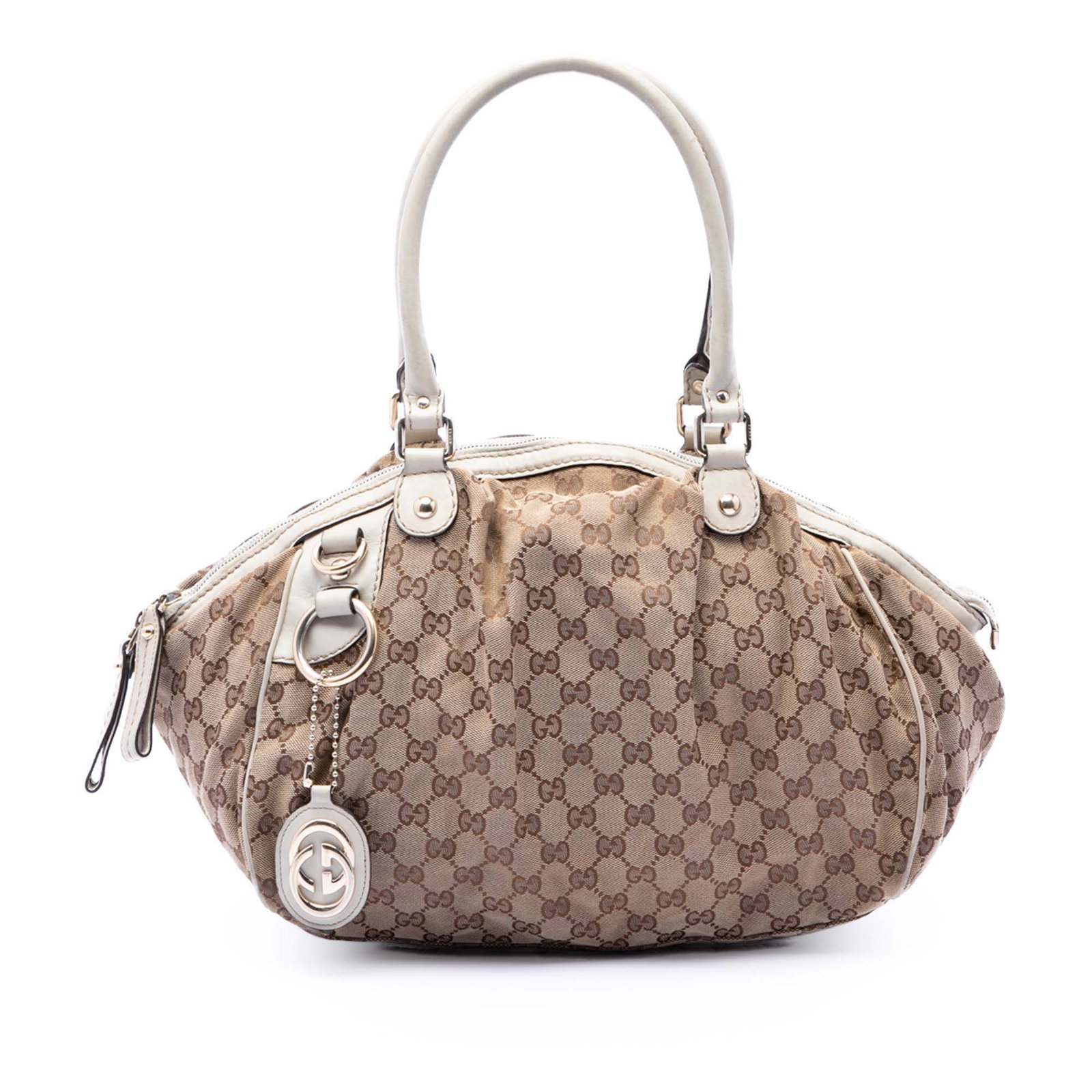 Gucci Beige GG Canvas Sukey Satchel Bag: Gucci Beige GG Canvas Sukey Satchel Bag This Gucci GG Canvas Sukey Satchel features a beige canvas body with leather trim, rolled leather handles, a top zip closure, and an interior zip pocket. The ba