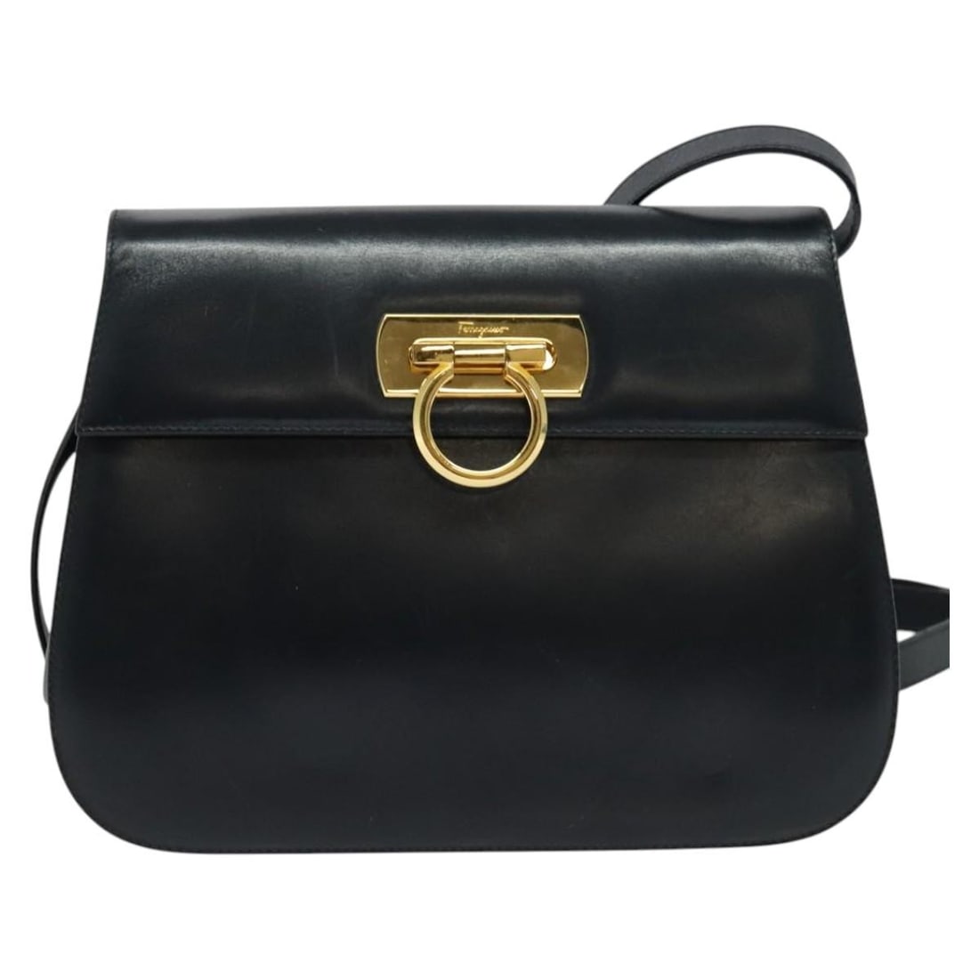 Salvatore Ferragamo Leather Navy Gancini Shoulder Bag: Salvatore Ferragamo Leather Navy Gancini Shoulder Bag This Salvatore Ferragamo Gancini shoulder bag features navy leather construction with a compact design suitable for female use. It shows signs of 