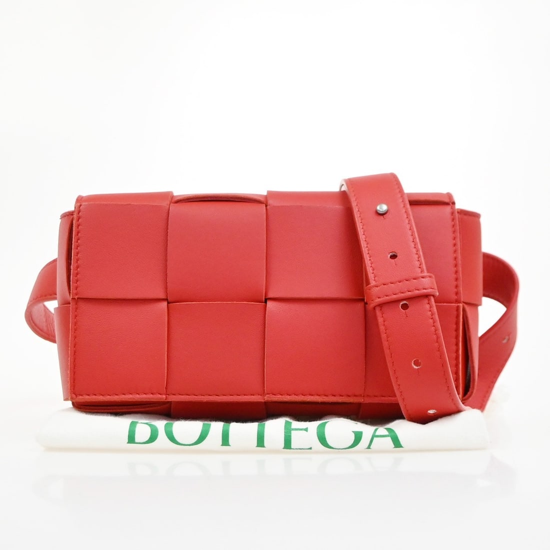 Bottega Veneta Cassette Belt Bag Red Leather: Bottega Veneta Cassette Belt Bag Red Leather This Bottega Veneta Cassette Belt Bag features the iconic Maxi Intrecciato leather design in a striking red color. Made in Italy, this unisex bag offers bo
