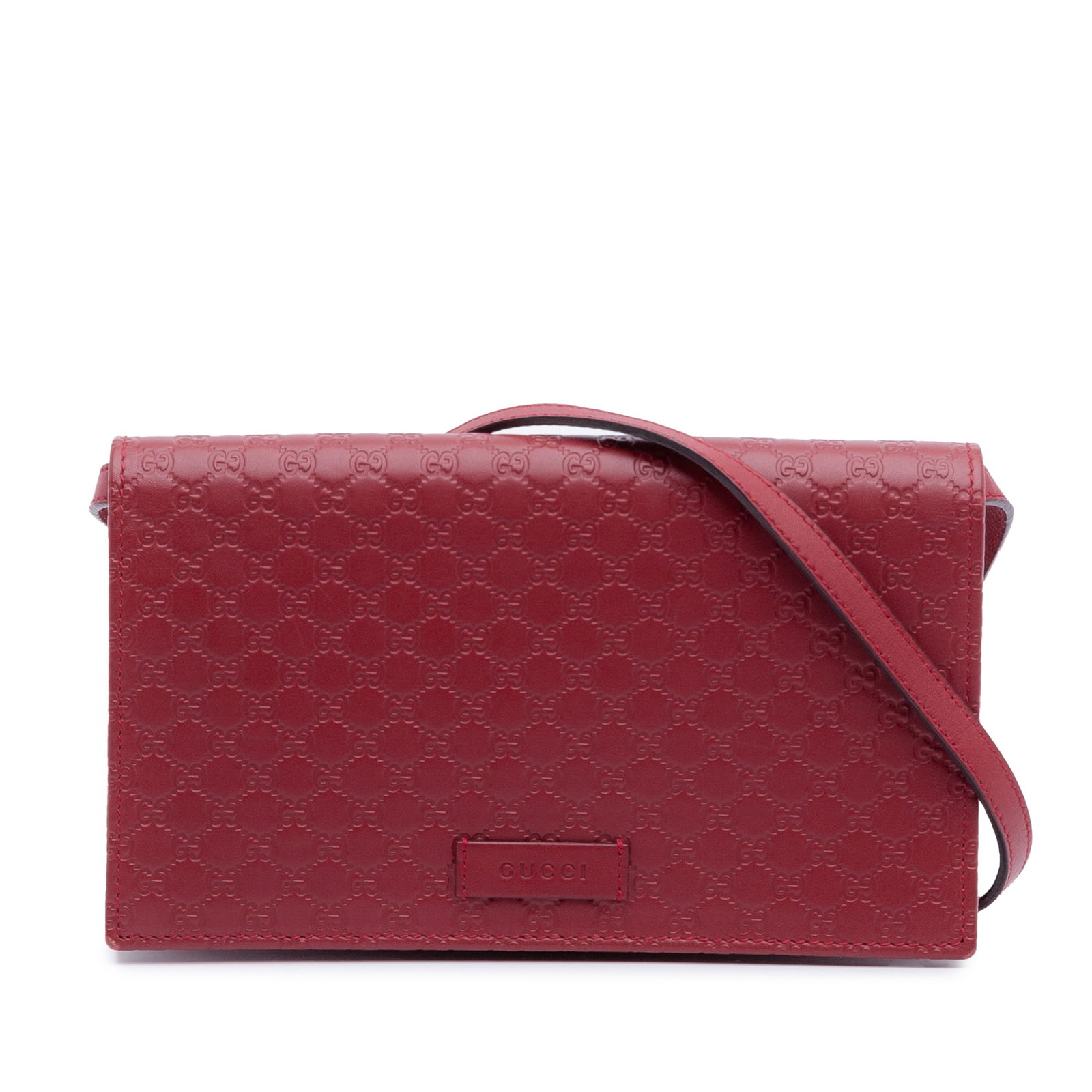 Gucci red leather crossbody wallet strap Microguccissima: Gucci red leather crossbody wallet strap Microguccissima This Gucci Microguccissima Wallet on Strap is a red crossbody bag crafted from embossed leather. It features a flat leather strap, a front flap