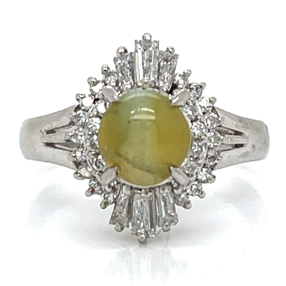 Elegant Platinum Cat's Eye Chrysoberyl Diamond Ring 1.69 Ct 36 Diamonds: Elegant Platinum Cat's Eye Chrysoberyl Diamond Ring 1.69 Ct 36 Diamonds This exquisite Platinum Cats Eye Chrysoberyl and Diamond Ring showcases a stunning 1.69 Ct. Cat's Eye Chrysoberyl, surrounded by