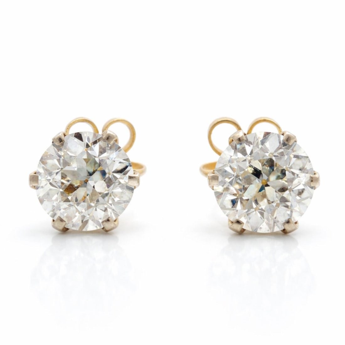 Diamond Stud Earrings 2.60 Ct European Cut in 18K Gold and Platinum: Diamond Stud Earrings 2.60 Ct European Cut in 18K Gold and Platinum These stud earrings are crafted in 18K yellow gold and platinum, featuring two European-cut diamonds with a total weight of approxim