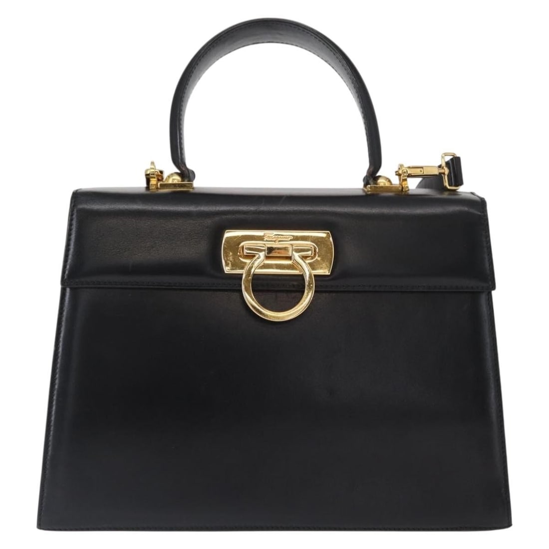 Ferragamo Black Leather Convertible Bag with Top Handle: Ferragamo Black Leather Convertible Bag with Top Handle This Salvatore Ferragamo convertible top handle bag is crafted from black leather and features a versatile design suitable for various occasions