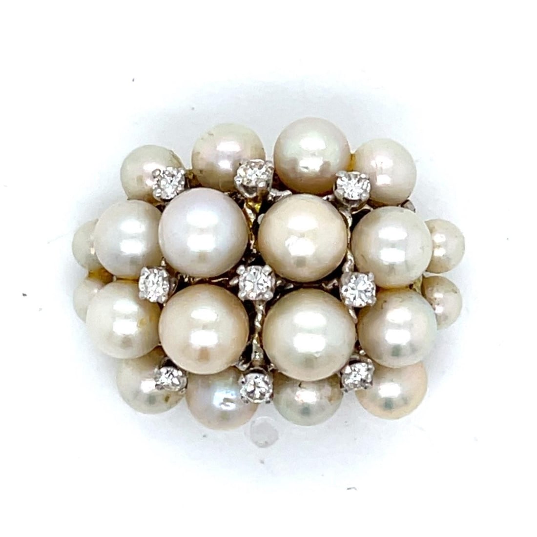 Vintage 14K White Gold Brooch with Cultured Pearl and Diamond Accents: Vintage 14K White Gold Brooch with Cultured Pearl and Diamond Accents This 1960s brooch is crafted from 14K white gold and features cultured pearls alongside nine diamonds with an approximate total we
