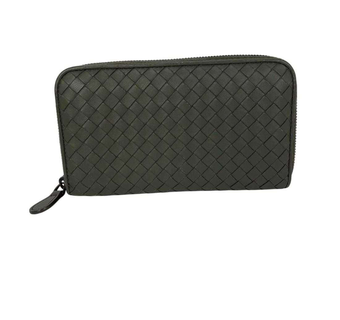 Bottega Veneta Intrecciato Leather Zip Wallet in Gray: Bottega Veneta Intrecciato Leather Zip Wallet in Gray This Bottega Veneta wallet clutch features a signature gray woven leather design. The compact, zip-around style is designed for women and includes