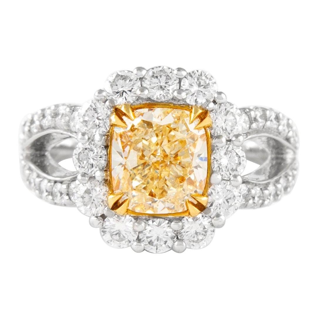 3.34ct Fancy Yellow Diamond Halo Ring 18k Gold: 3.34ct Fancy Yellow Diamond Halo Ring 18k Gold Presenting a stunning 3.34ct Fancy Yellow Cushion Diamond Halo Ring, crafted in a luxurious combination of 18k yellow and white gold. This contemporary p