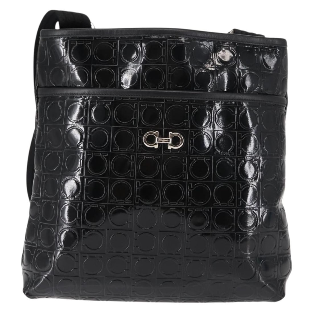 Gancini Patent Leather Black Shoulder Bag by Salvatore Ferragamo: Gancini Patent Leather Black Shoulder Bag by Salvatore Ferragamo This Salvatore Ferragamo Gancini shoulder bag is crafted from black patent leather and features a sleek, feminine design. The bag is pr