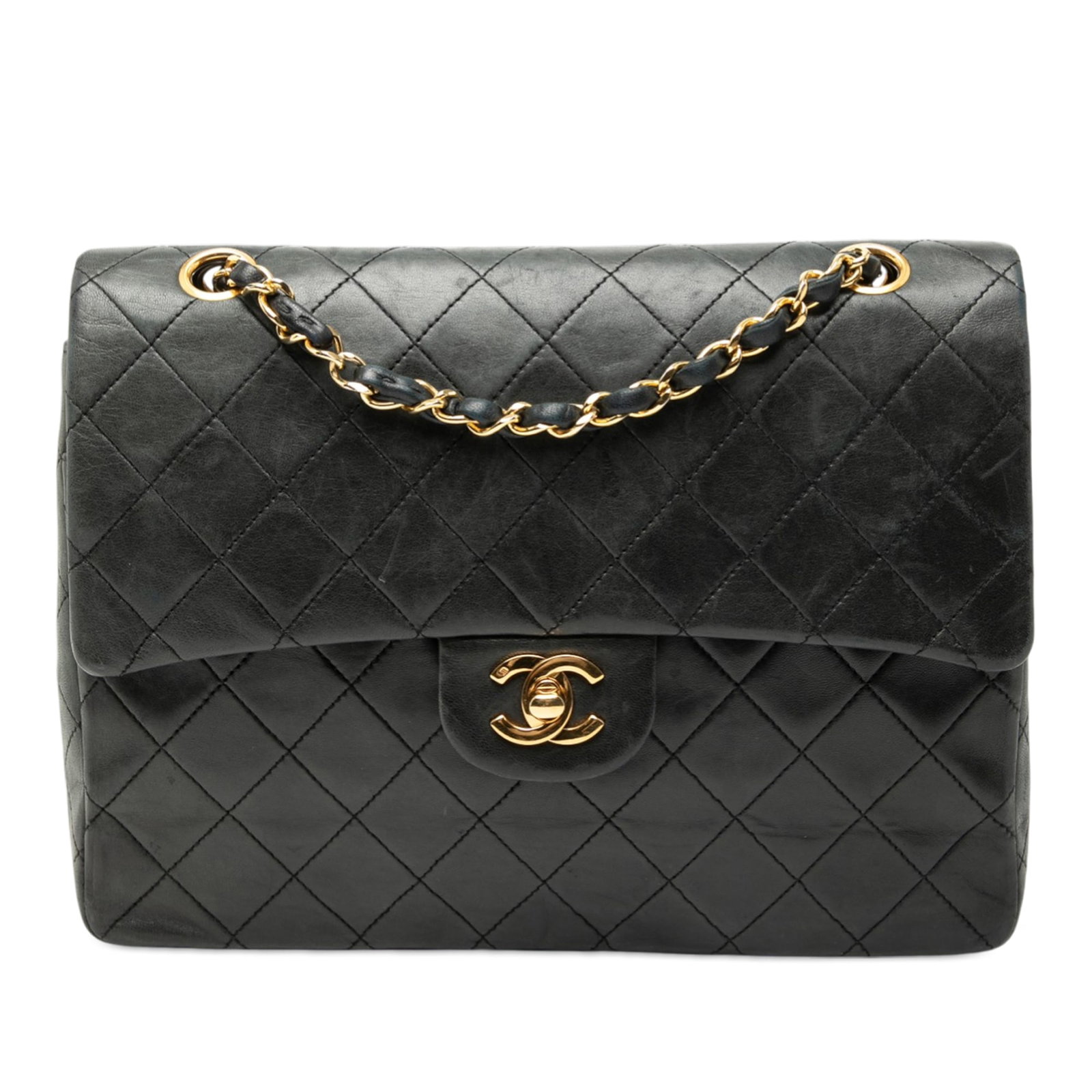 Chanel Black Lambskin Quilted Medium Tall Double Flap Shoulder Bag: Chanel Black Lambskin Quilted Medium Tall Double Flap Shoulder Bag This Chanel Medium Tall Classic Lambskin Double Flap shoulder bag features a quilted lambskin leather body in black, complemented by 