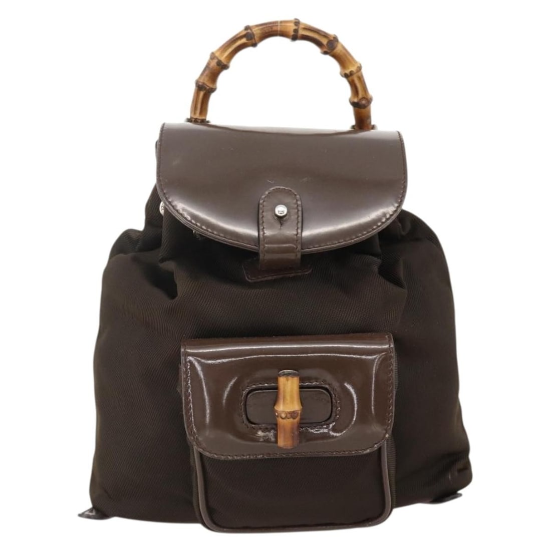 Gucci Vintage Bamboo Brown Nylon and Patent Leather Backpack Bag: Gucci Vintage Bamboo Brown Nylon and Patent Leather Backpack Bag This Gucci Vintage Bamboo Backpack is crafted from brown nylon with patent leather accents, designed for women. Featuring the iconic ba