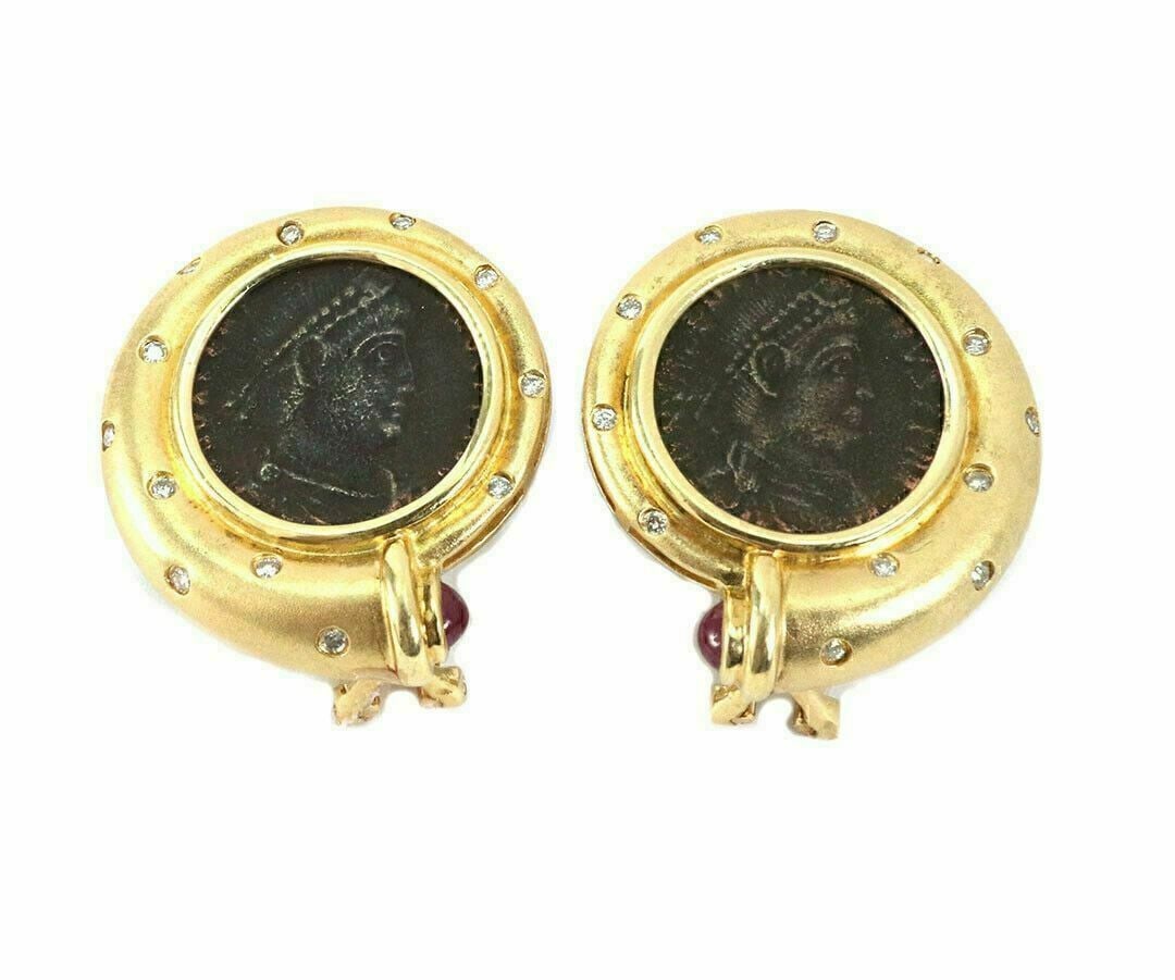 Vintage 18k Yellow Gold Coin Motif Earrings with Diamonds Rubies: Vintage 18k Yellow Gold Coin Motif Earrings with Diamonds Rubies These vintage coin motif post clip earrings are crafted from solid 18k yellow gold and feature bronze coin accents for a distinctive, c