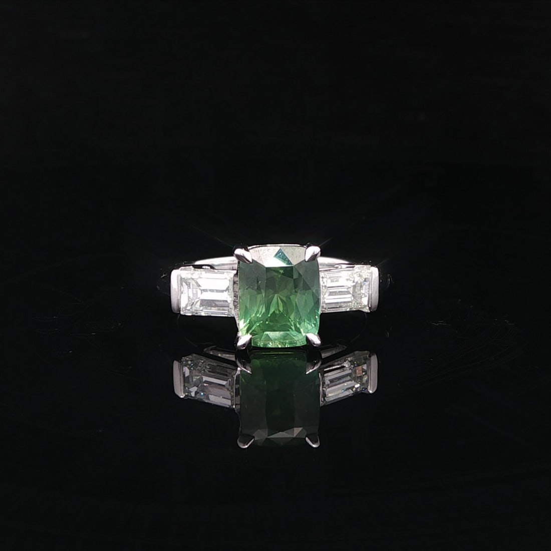 Platinum Montana Sapphire and GIA Diamond Three-Stone Ring 4ctw: Platinum Montana Sapphire and GIA Diamond Three-Stone Ring 4ctw This un-used cocktail ring features a 3.01 carat natural Montana sapphire in a cushion brilliant step cut, displaying a bluish green col