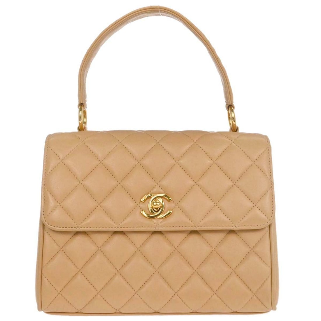 Beige Quilted Lambskin Chanel Vintage Flap Bag with Top Handle: Beige Quilted Lambskin Chanel Vintage Flap Bag with Top Handle This Chanel Vintage Top Handle Flap Bag features a classic quilted lambskin leather exterior in beige, designed for women. The bag is in 